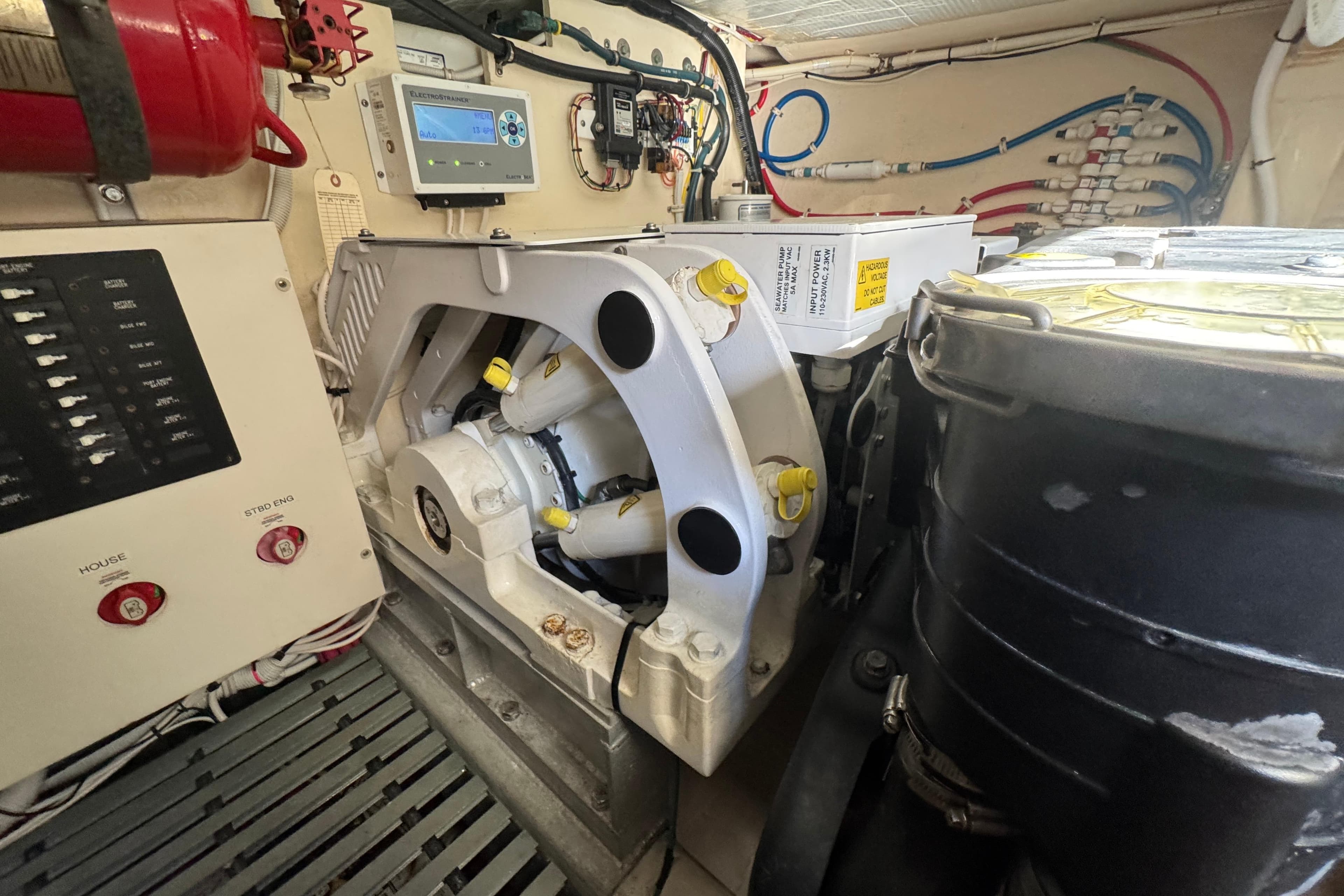 Engine room of 2016 Tiara Yachts C44 Coupe with mechanical components and control panels.