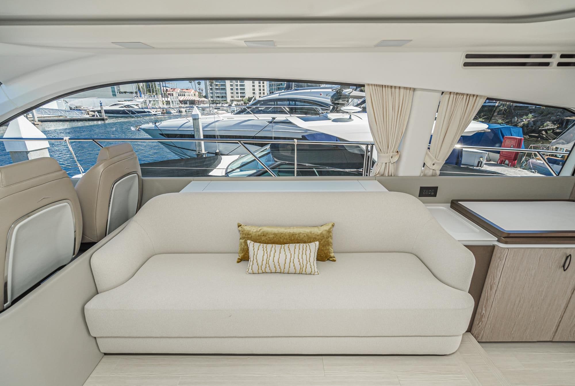 Luxurious interior of 2024 Azimut Fly 53 yacht with marina view.