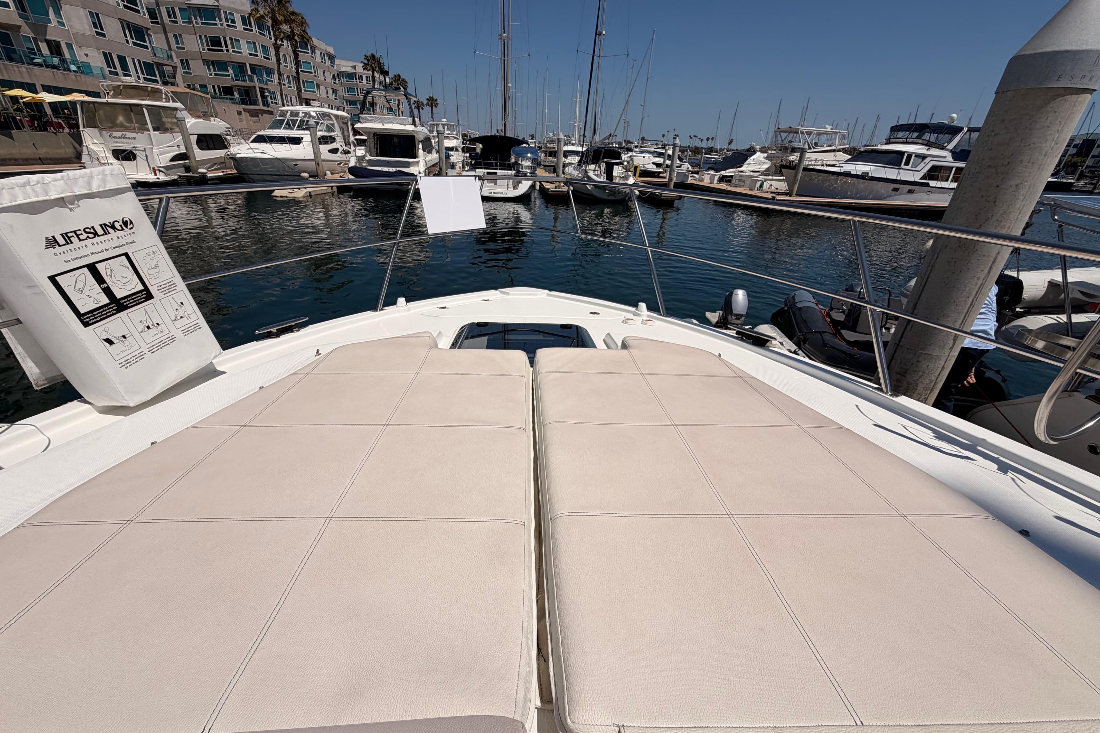 2020 Cruisers Yachts 390 Express Coupe at marina, featuring spacious sunbathing deck.
