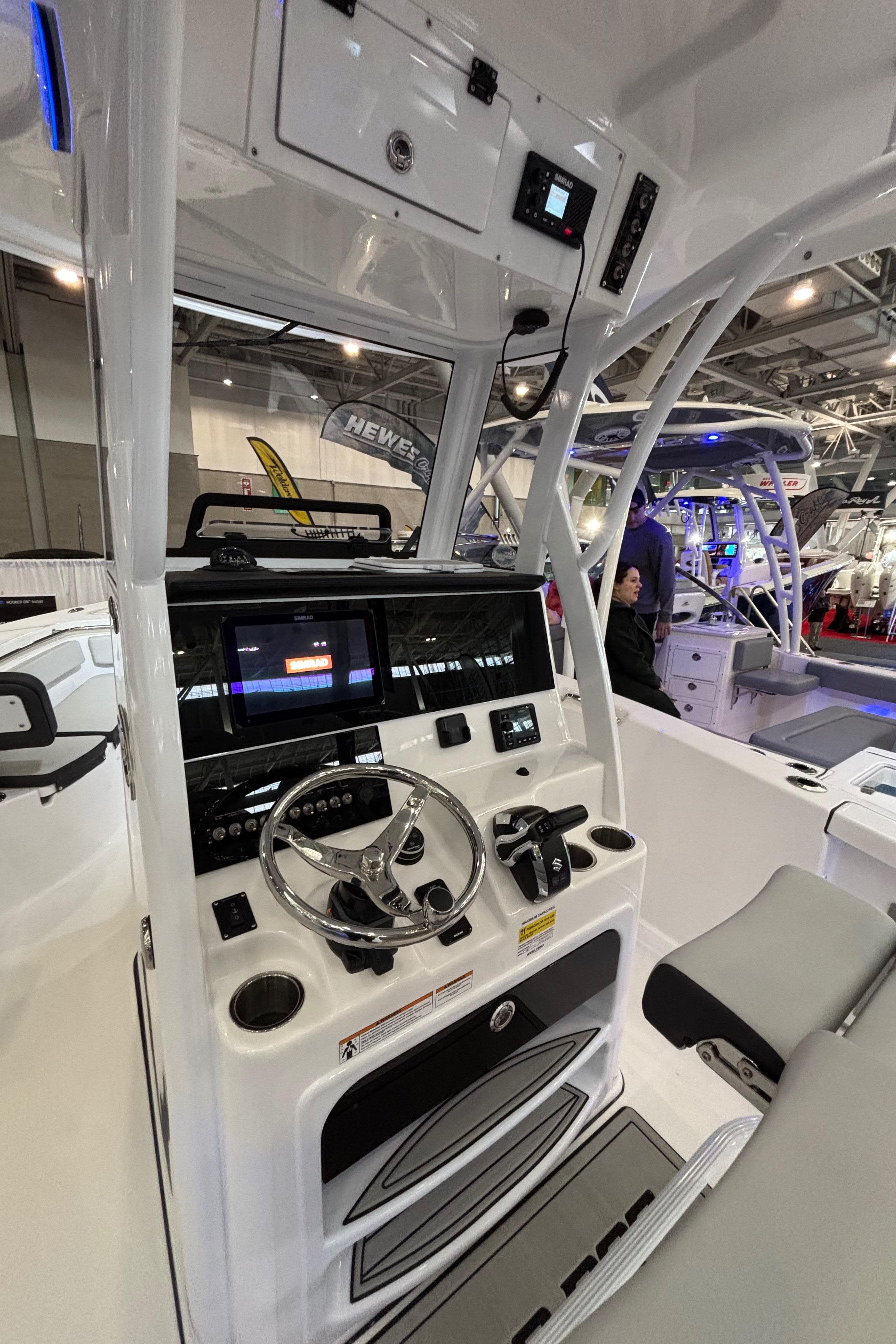 2025 Sea Pro 242 Center Console boat interior with modern dashboard and controls.