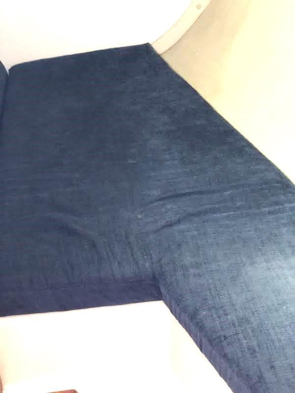 Blue fabric upholstery on a 1990 Hunter Vision 32 boat interior.