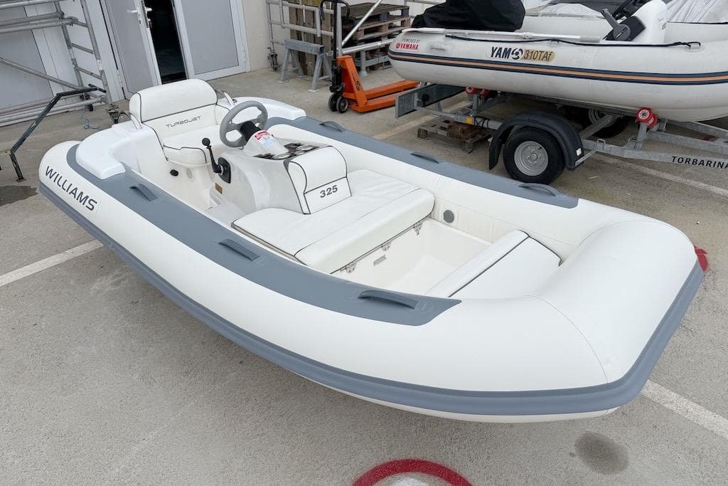 2009 Williams Jet Tenders Turbojet 325 inflatable boat in a storage area.