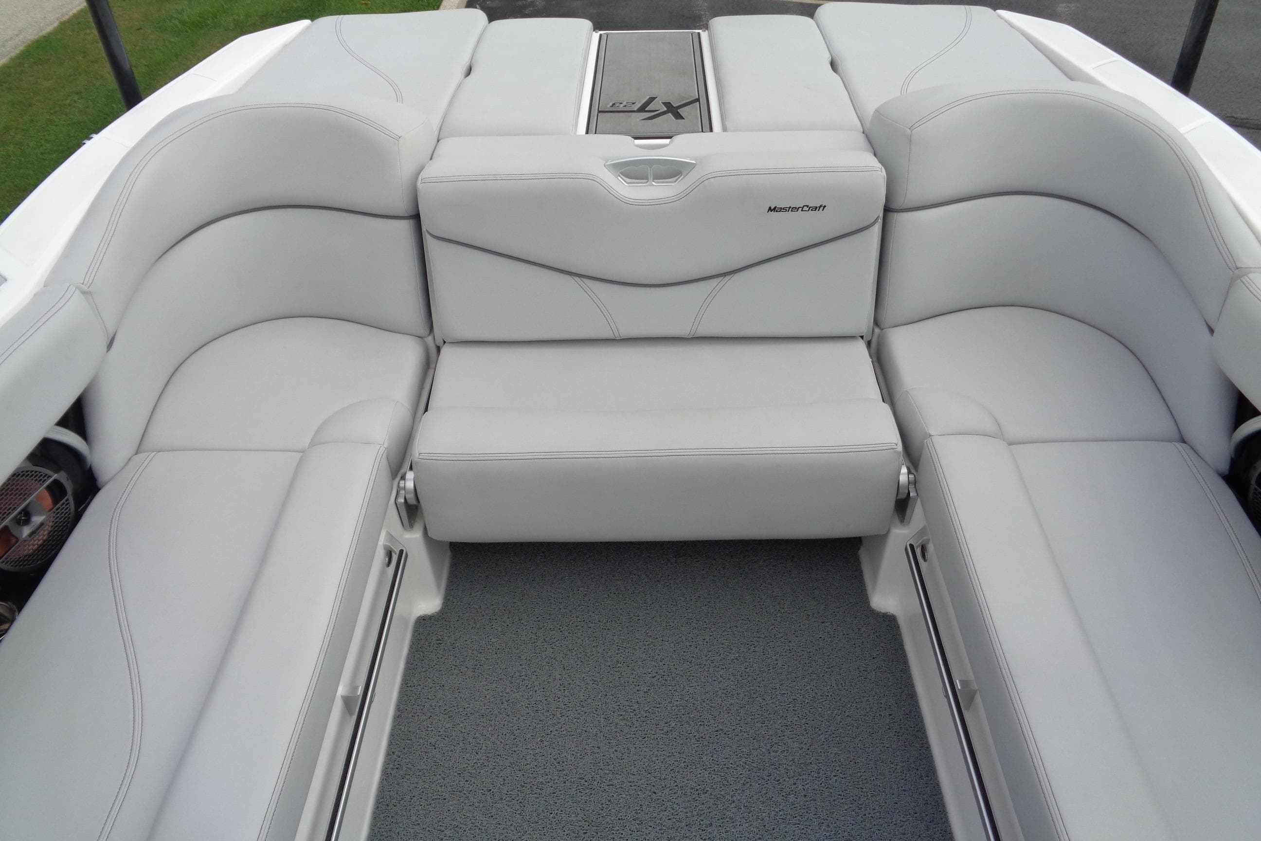 2020 MasterCraft XT23 boat interior with luxurious white seating and modern design.
