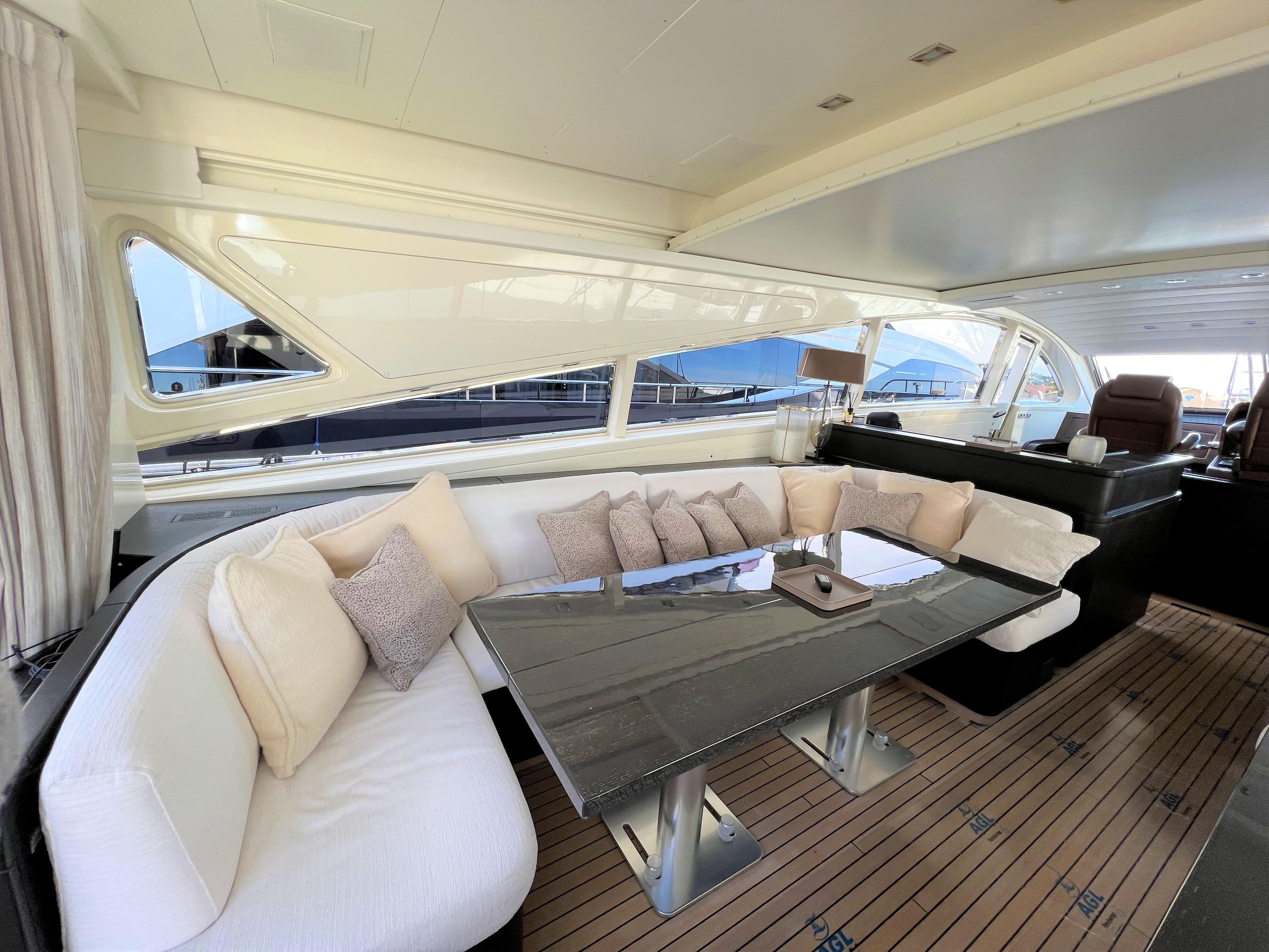 Luxurious interior of 2008 Arno Leopard 27 yacht with elegant seating and table.