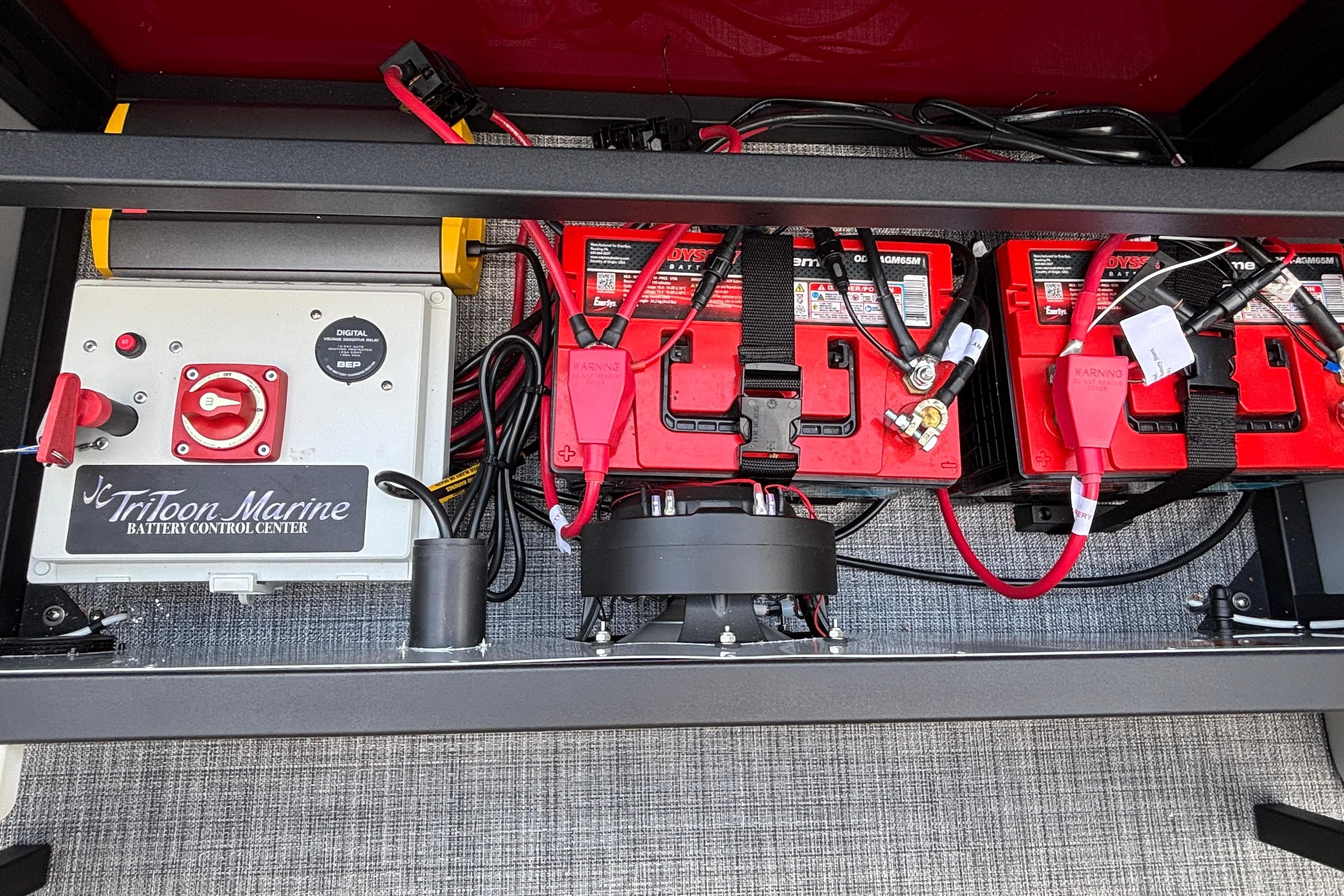 Battery control center of JC Sporttoon 26TT, 2026 model, featuring Odyssey batteries and wiring setup.