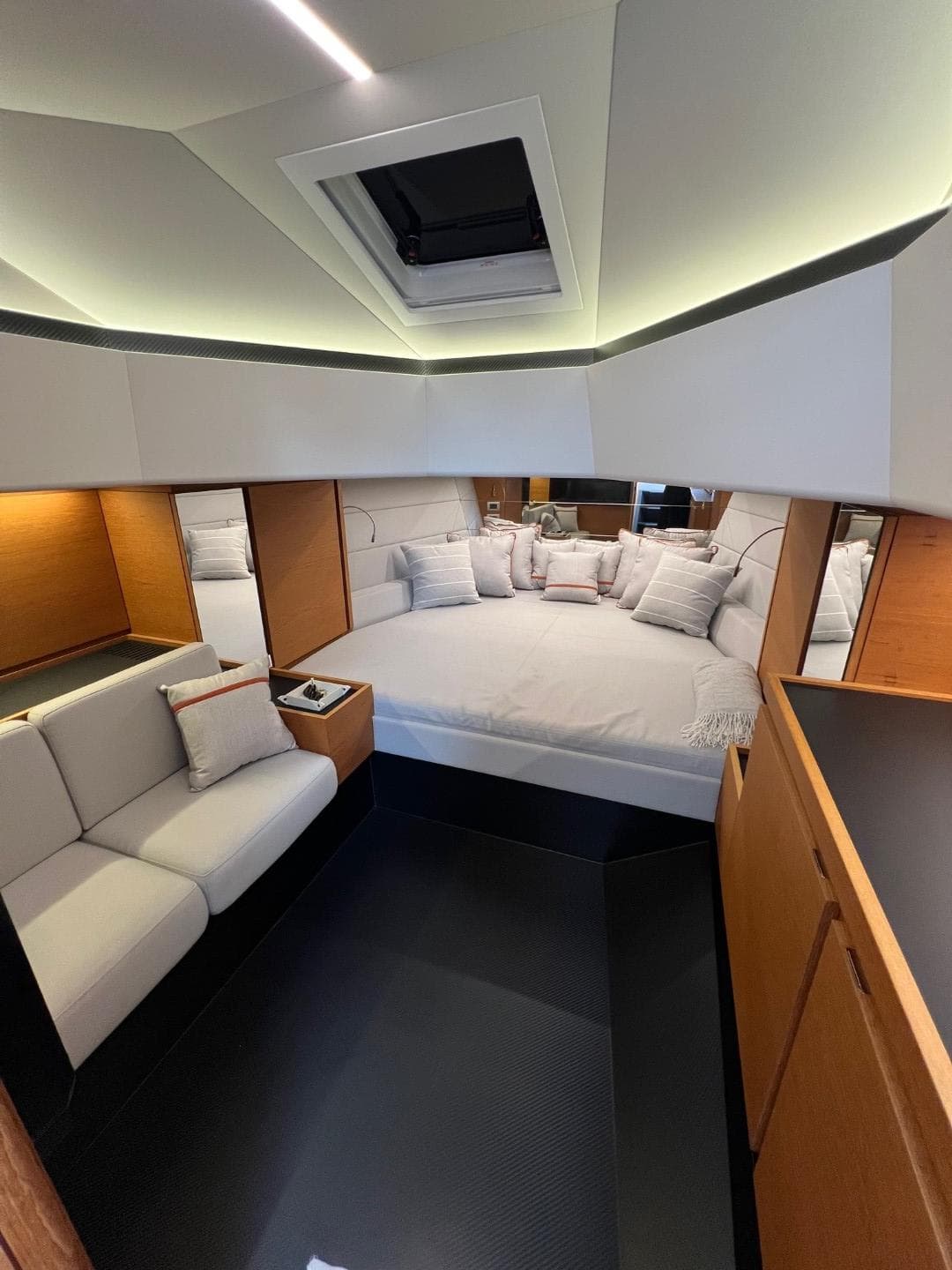 Luxurious interior of 2023 Wally 48 X yacht with modern design and cozy seating.