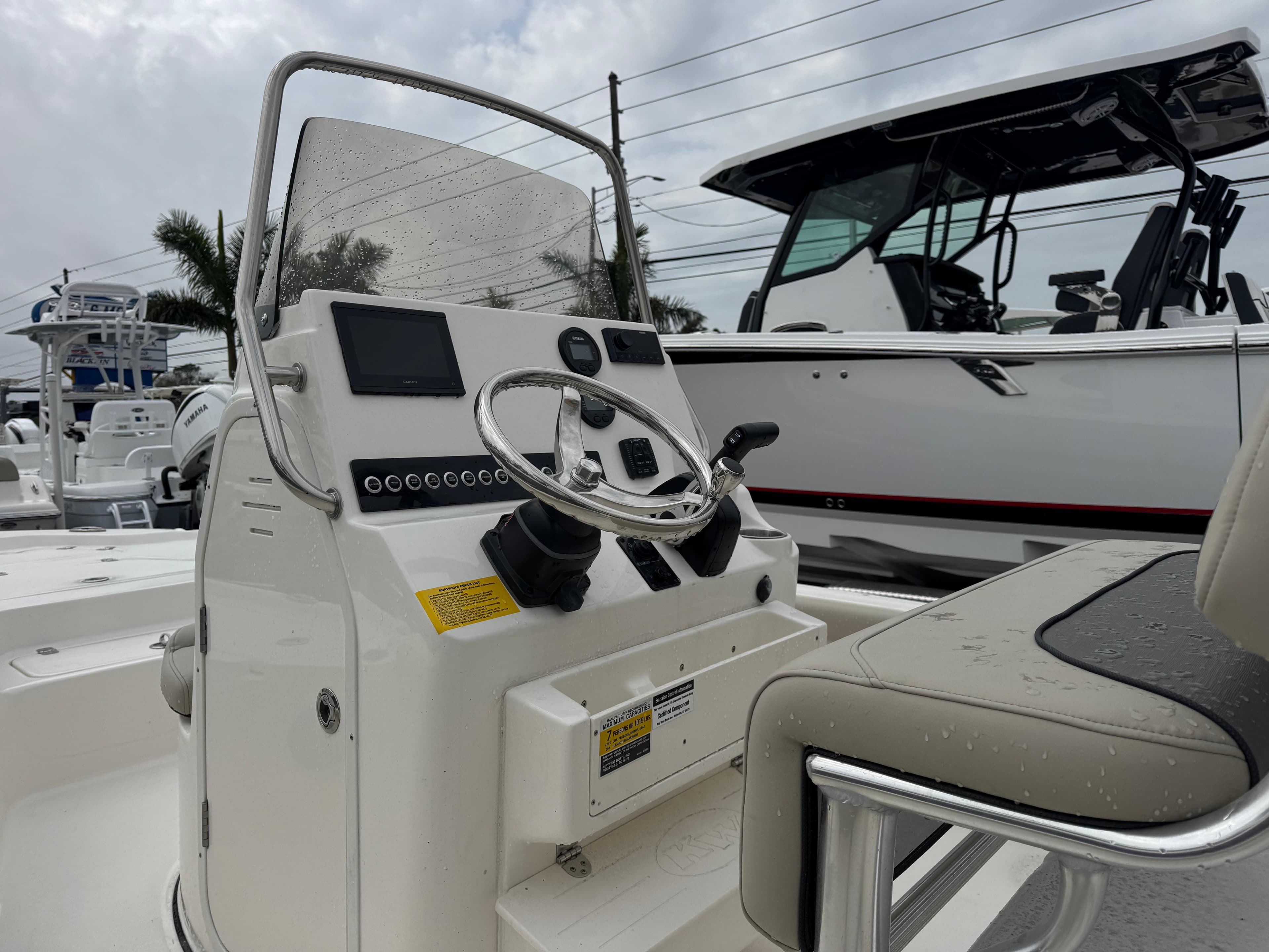 2025 Key West 210 Bay Reef boat console with steering wheel and controls.
