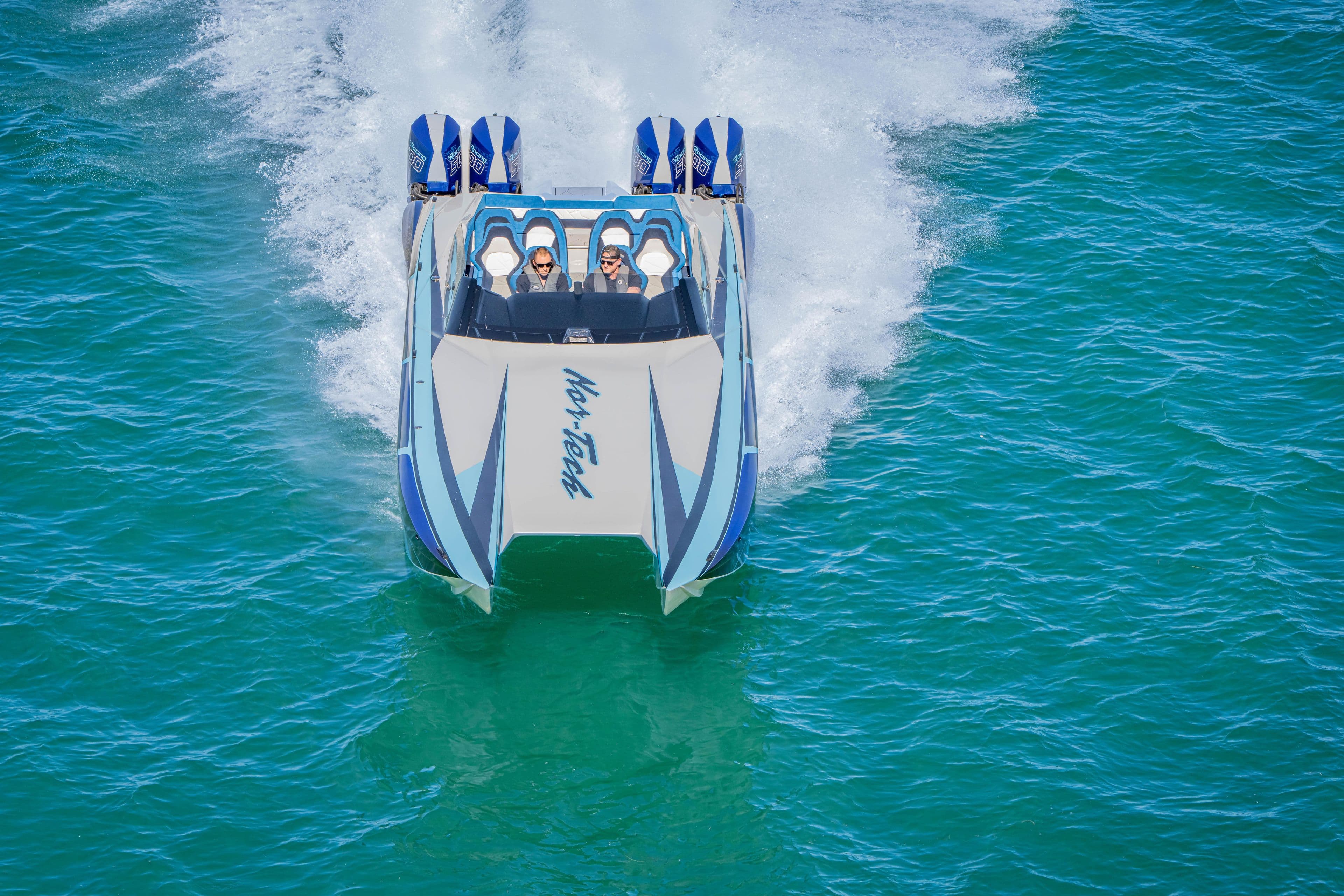 2026 Nor-Tech 4000 Super Catamaran speeding on blue ocean waters.