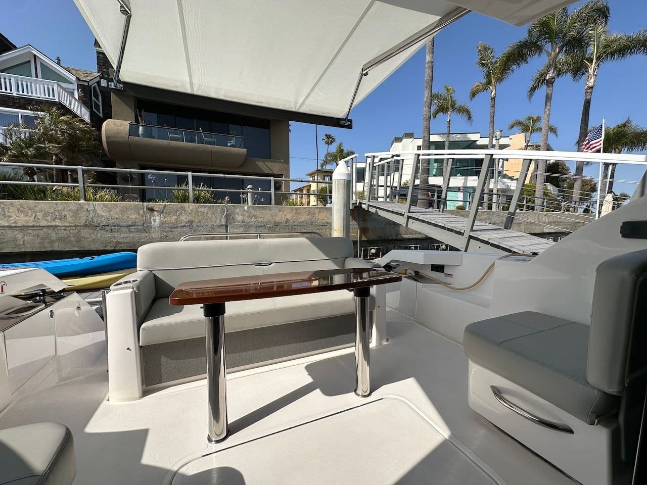 Interior of 2019 Tiara Yachts Coupe 39 with seating area and table.