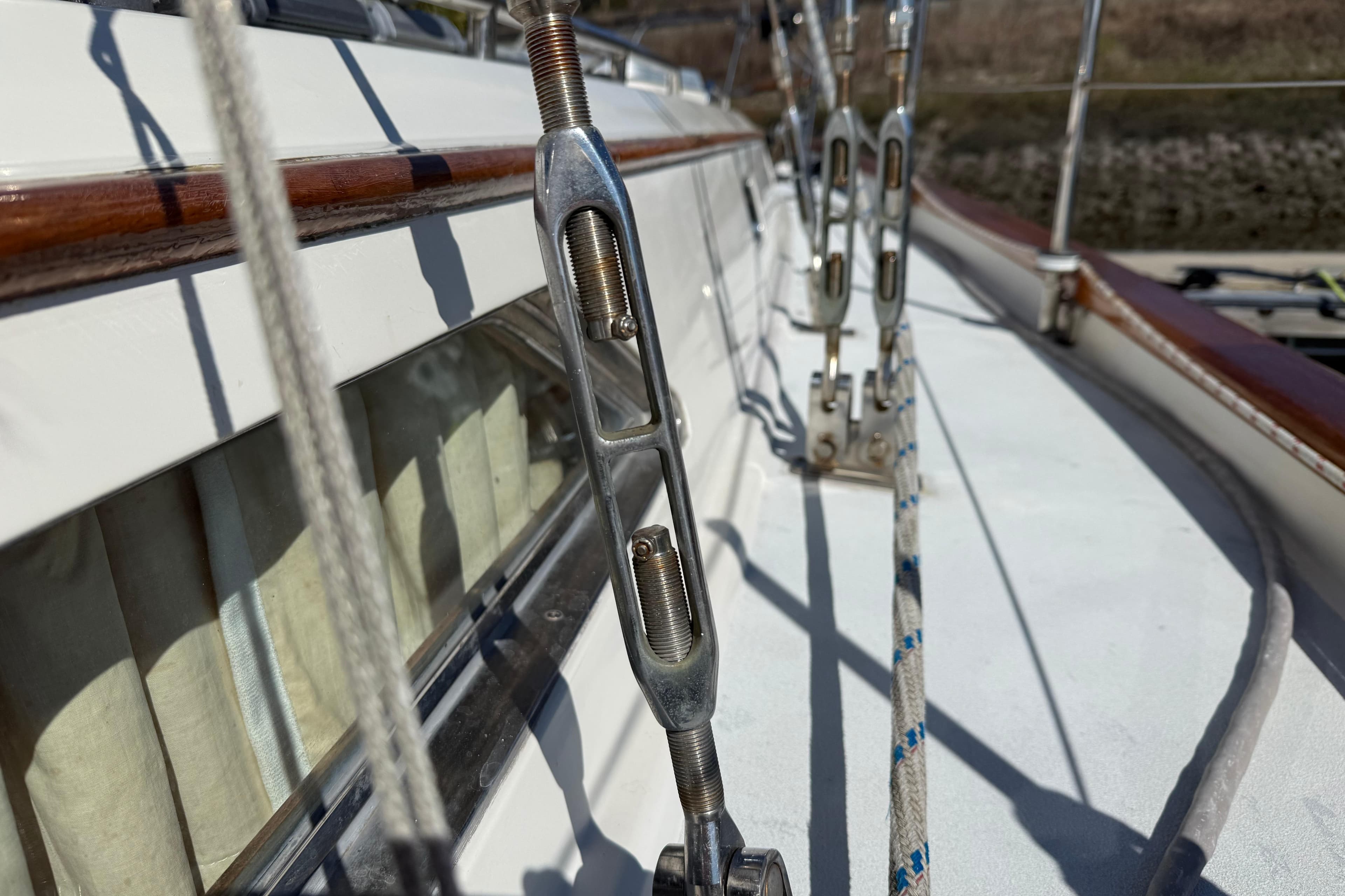 Close-up of sailboat rigging on a 1999 Passport 456 yacht deck.