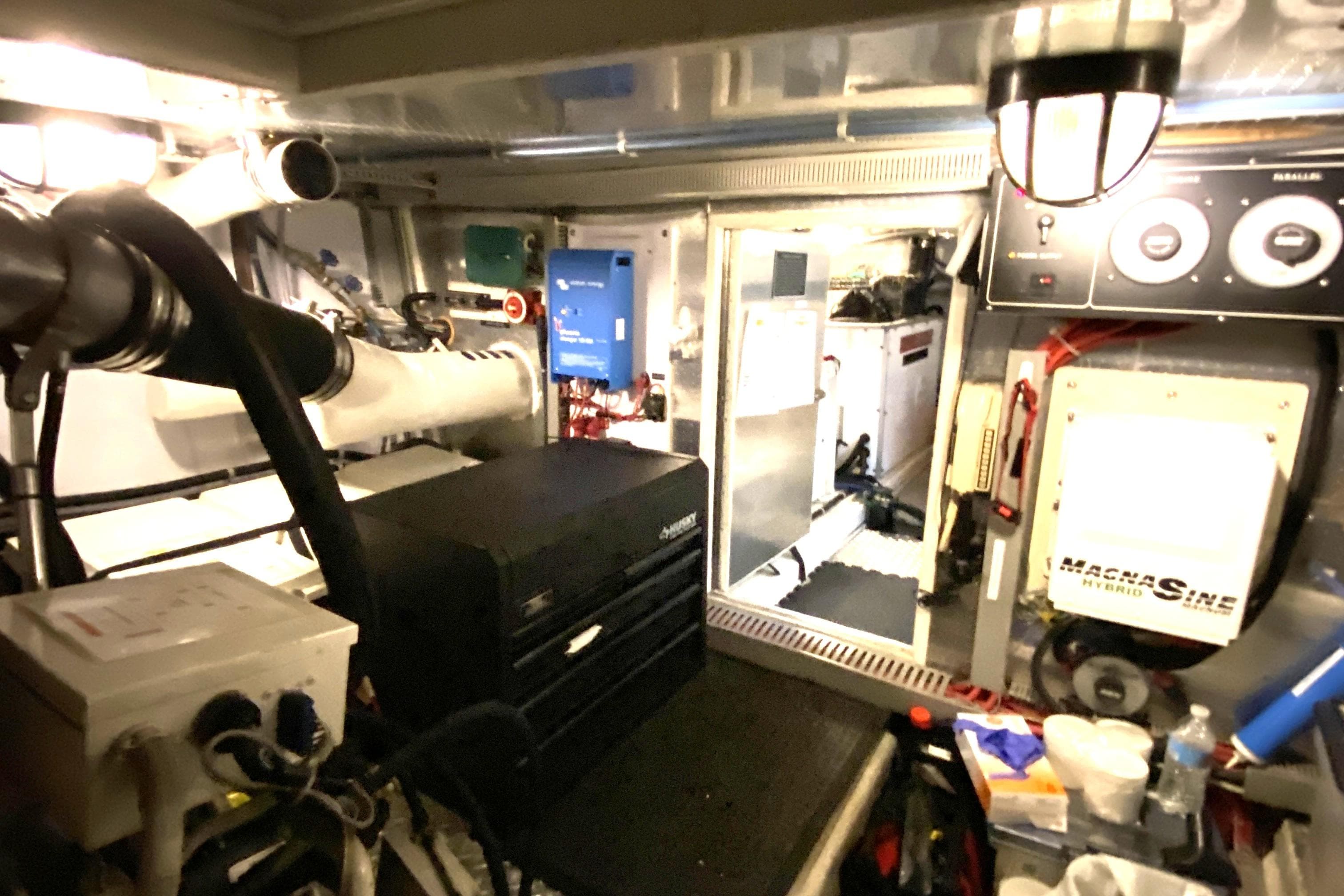 Engine room of a 2000 Compass 55 yacht with various equipment and controls.