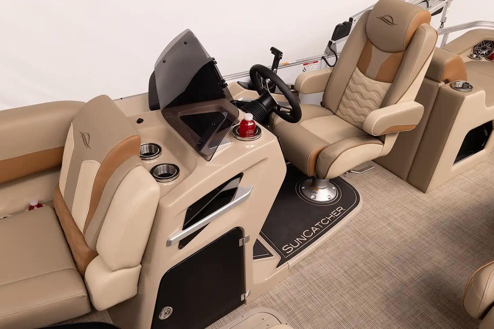 Luxurious interior of 2026 SunCatcher Elite 322SR boat with plush seating and modern helm.