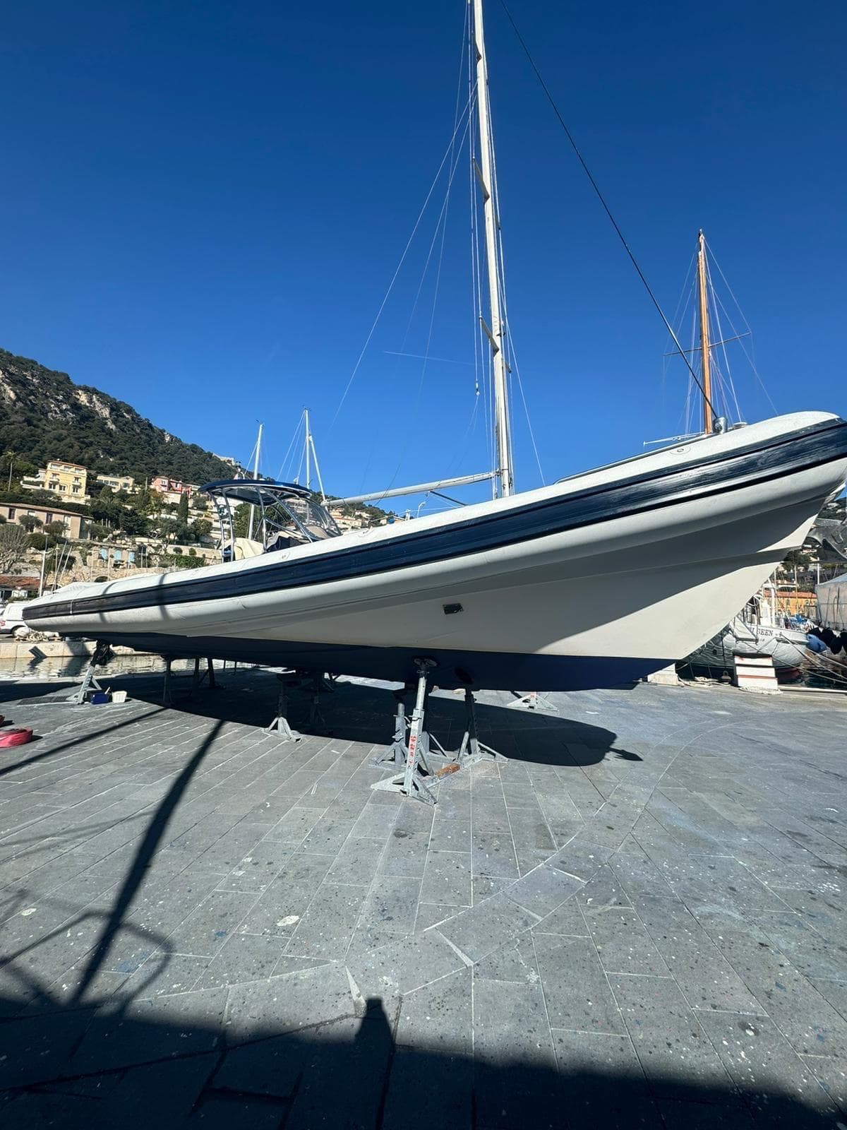 2008 Sea Water Convertible 430 boat on dry dock under clear blue sky.