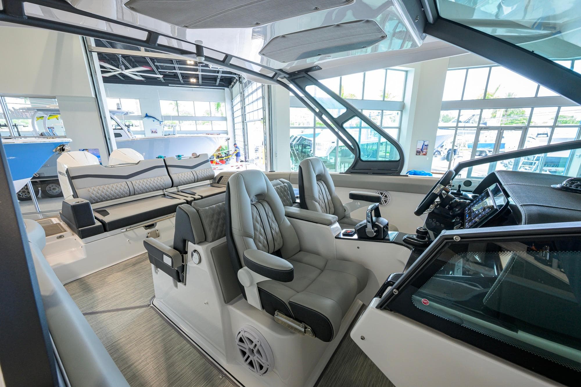 Interior of 2026 Monterey Elite 30 OB boat with luxurious seating and modern controls.