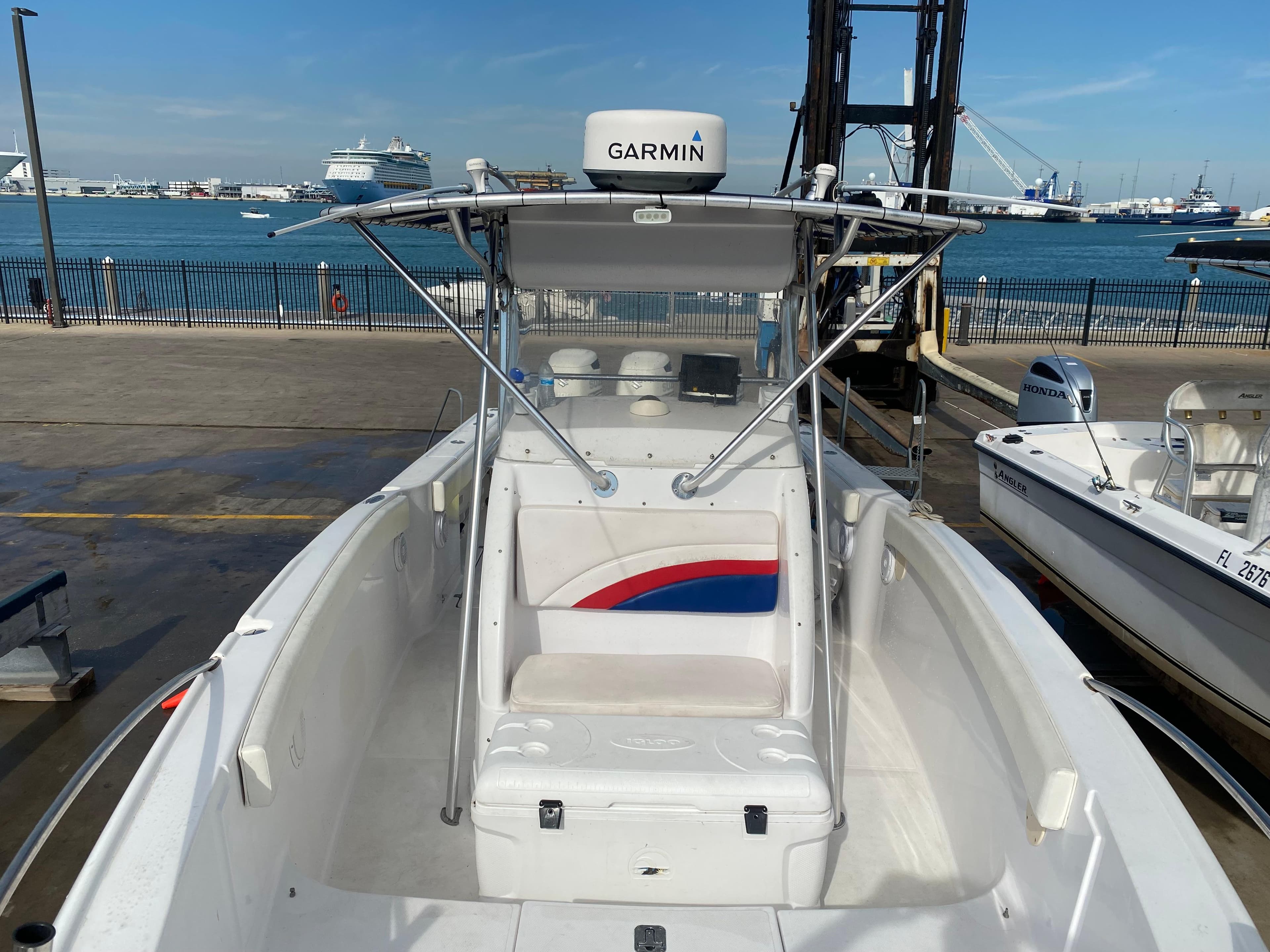 2000 Donzi 35 ZF Open boat with Garmin equipment, docked by the waterfront.