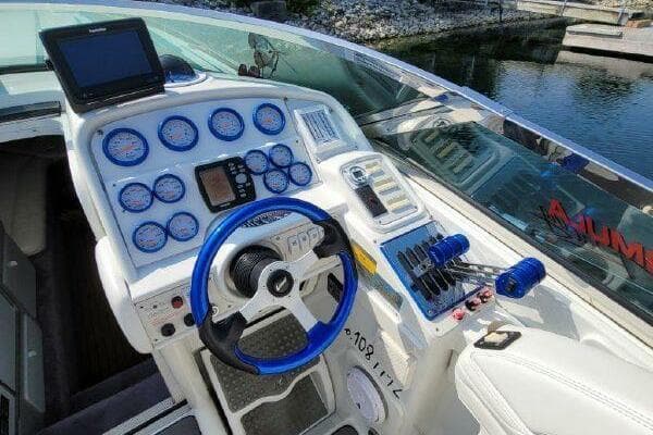 1999 Formula 419 FASTech boat dashboard with blue accents and multiple gauges.