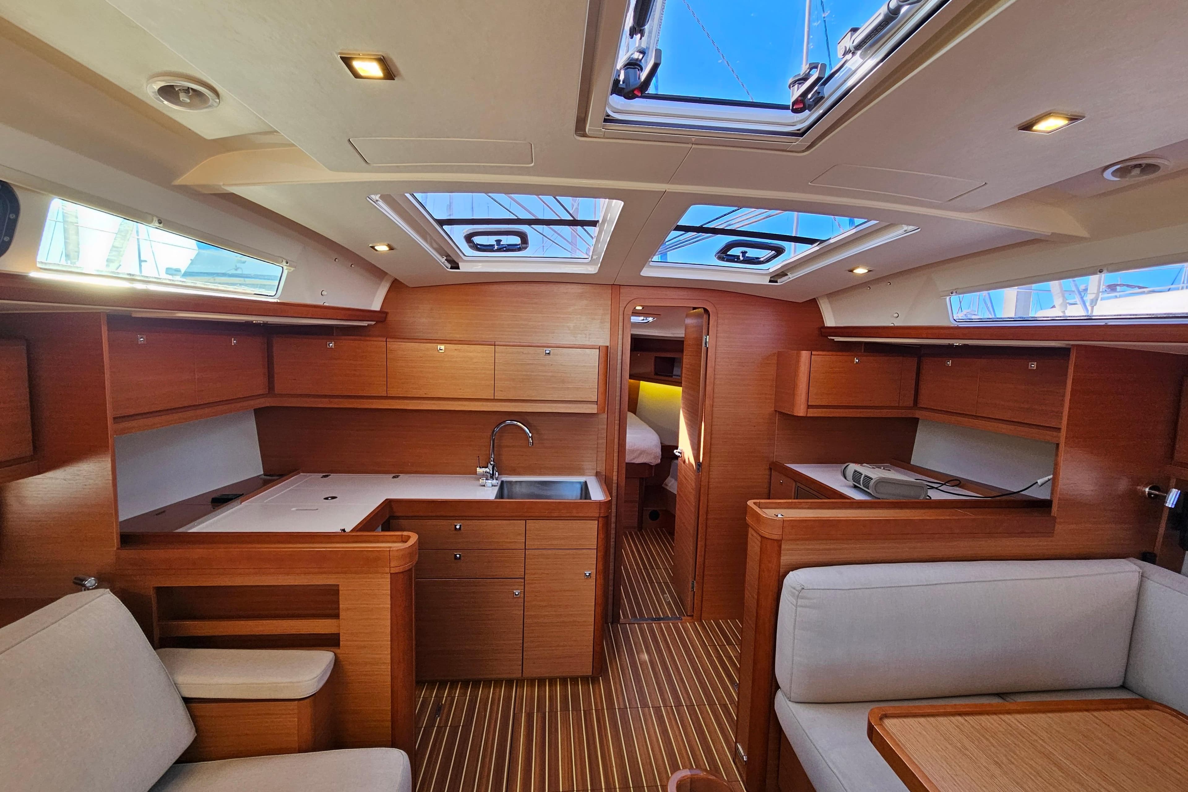 Luxurious interior of 2018 Dufour 460 Grand Large yacht with modern wood finish.