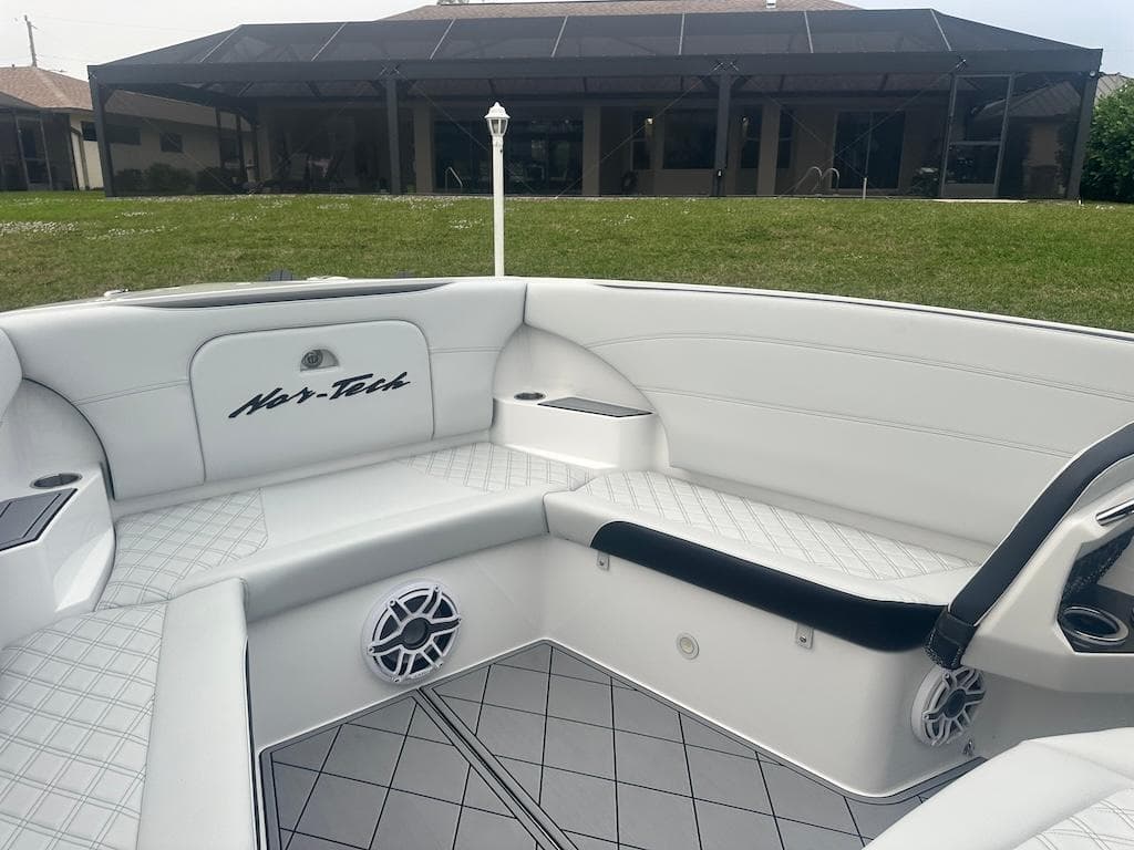 2024 Nor-Tech 340 Sport Center Console interior with white seating and modern design.