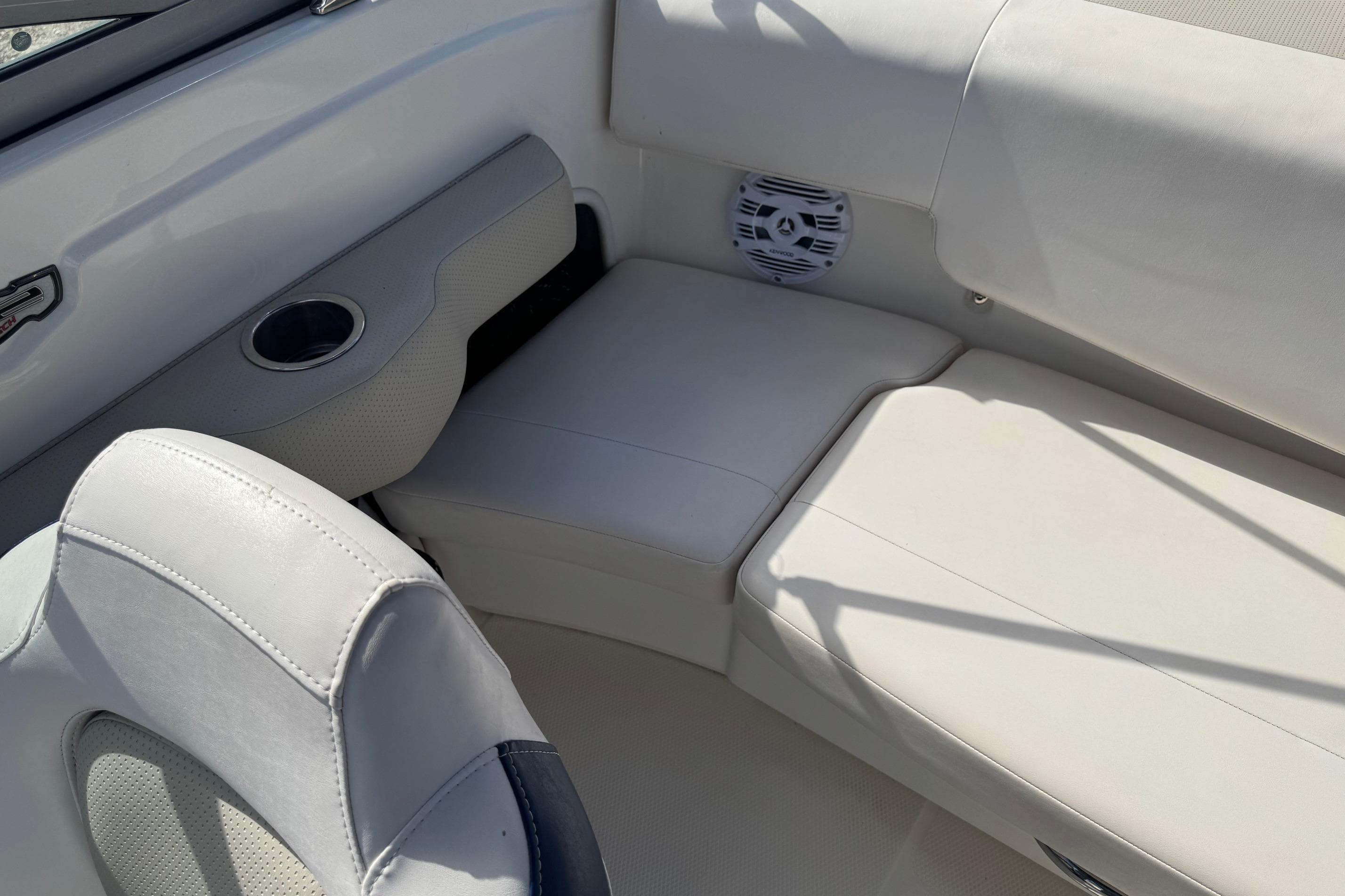 2011 Chaparral 186 SSi boat interior with white seating and speaker.