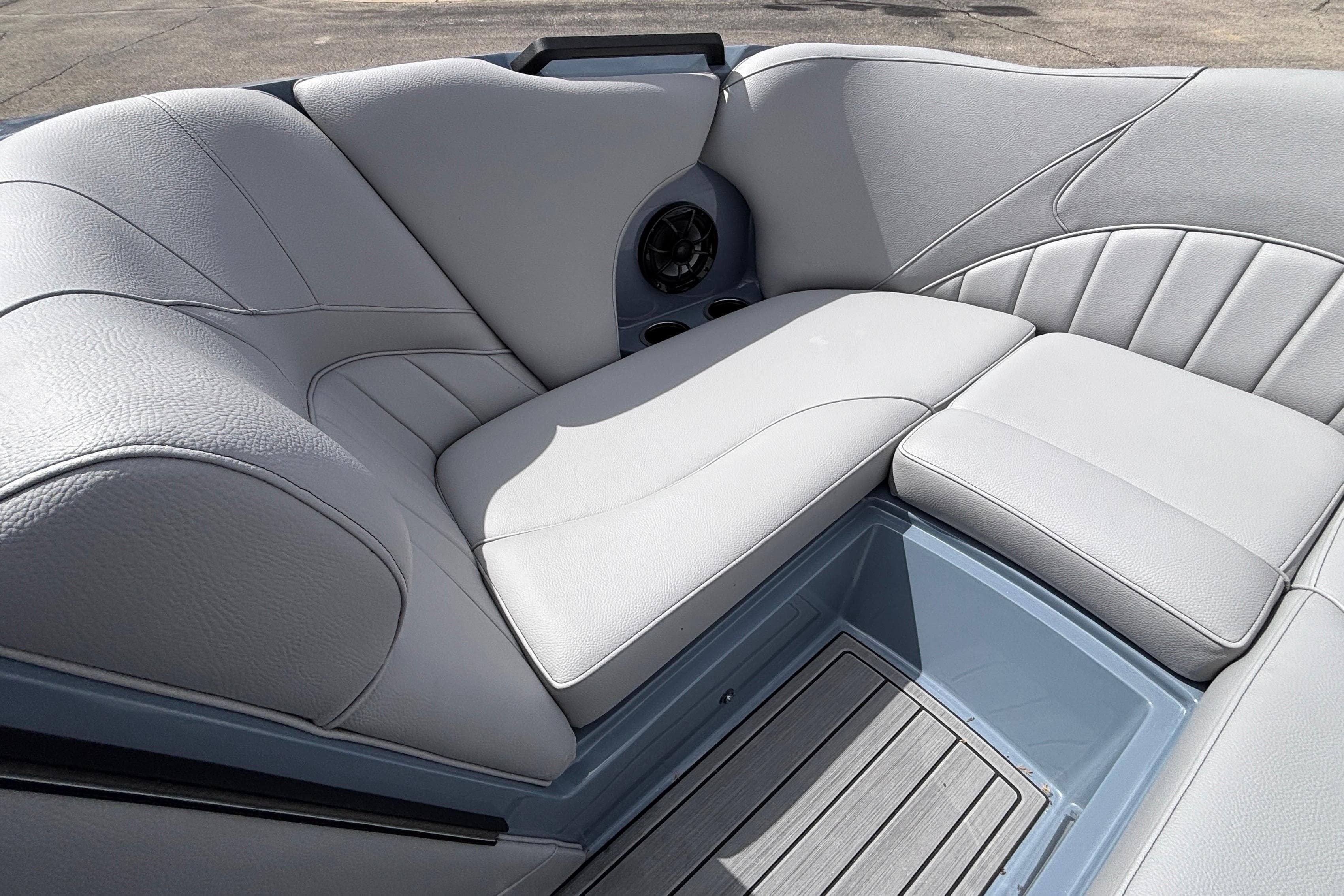 Luxurious seating in 2026 MB B52 23 Classic boat, featuring sleek gray upholstery.