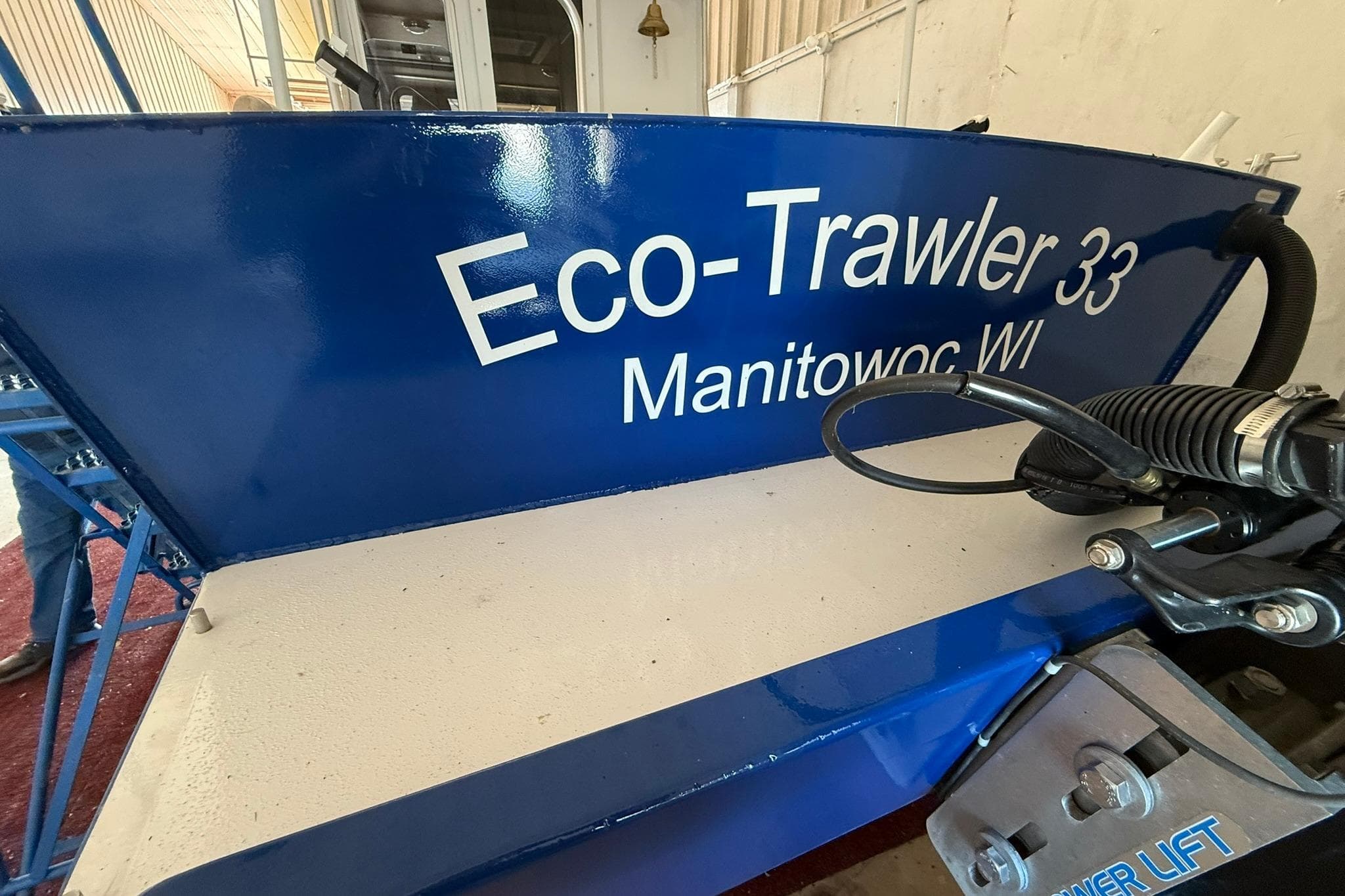 Blue Eco-Trawler 33 boat, Manitowoc WI, 2013 model, in a storage facility.