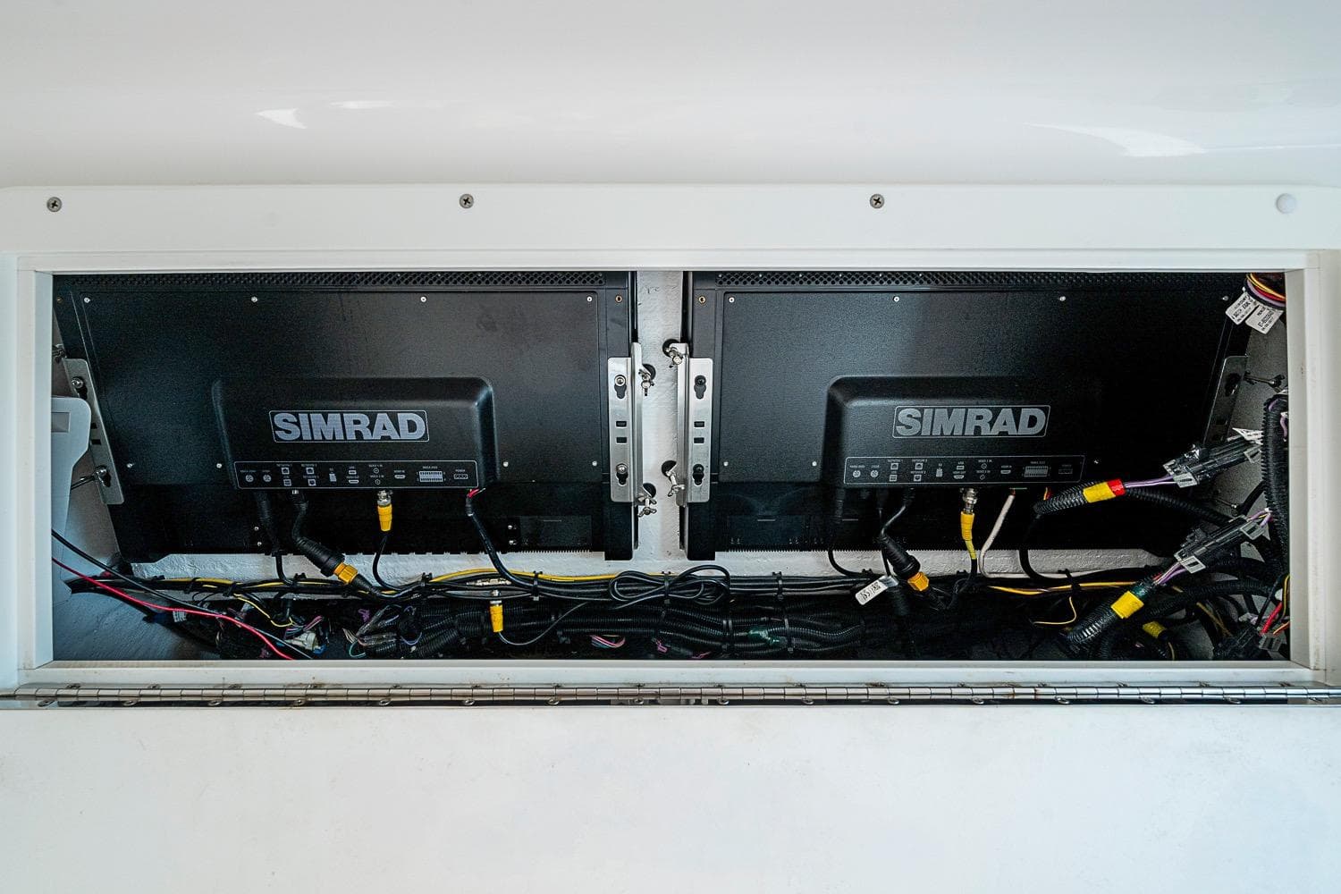 Simrad electronics setup on 2018 Invincible 40 Catamaran, showcasing wiring and installation.