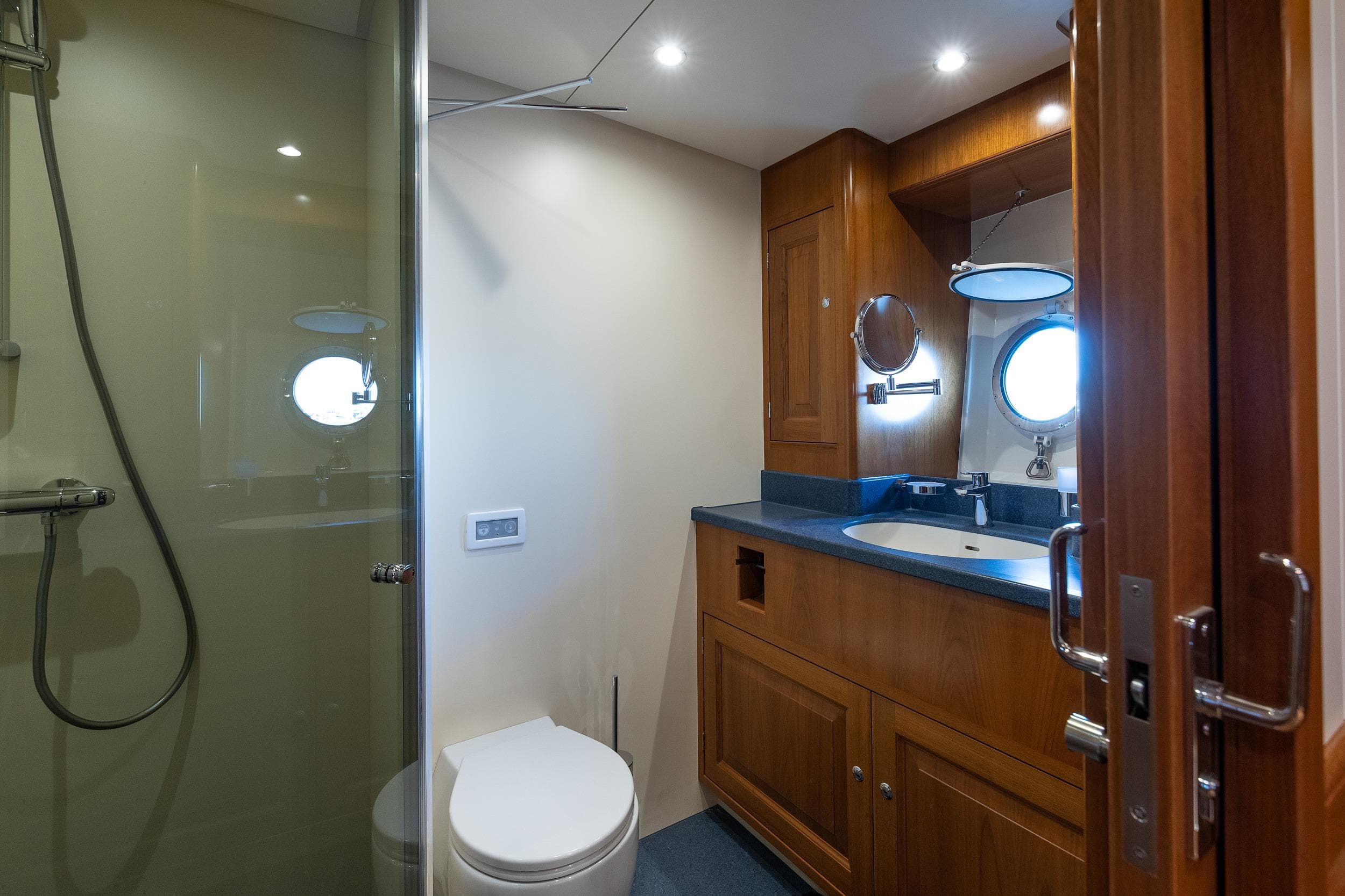 Luxurious bathroom on 2022 Ridas Custom Yacht with modern fixtures and wooden cabinetry.