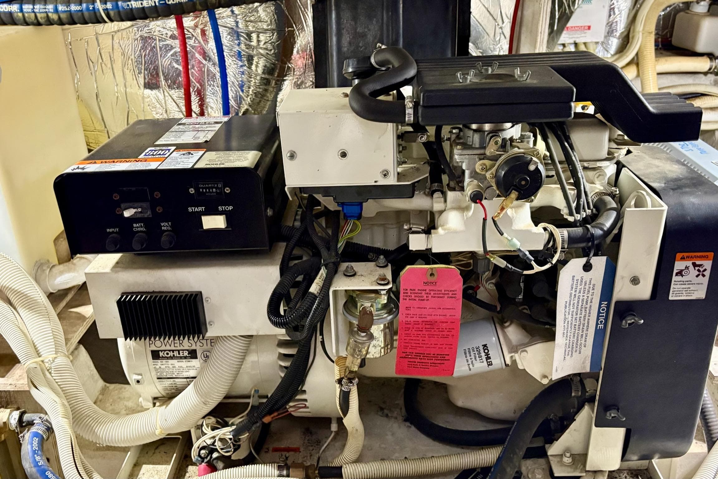 Engine room of a 2003 Carver 396 Motor Yacht with Kohler power system.