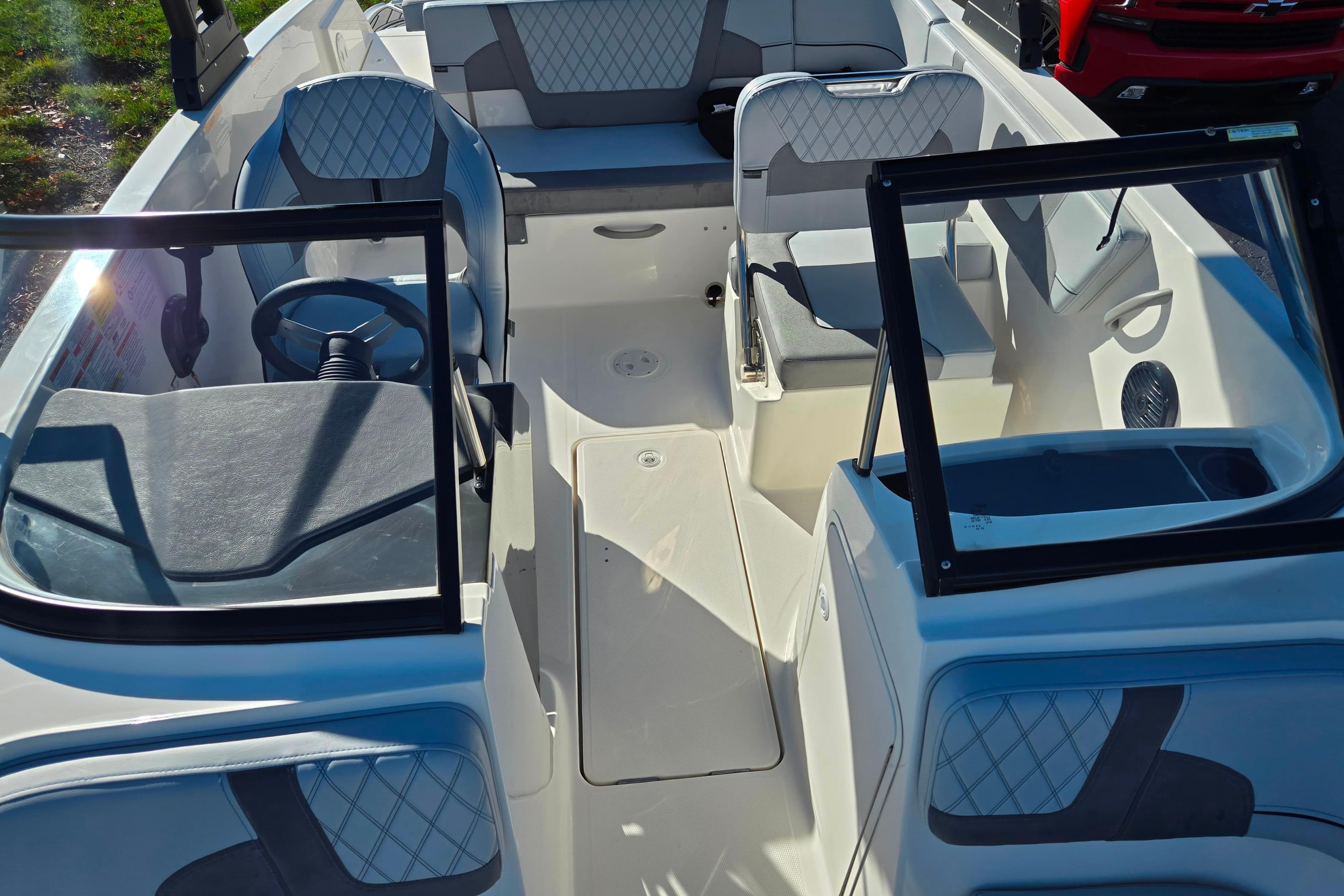 2024 Bayliner VR5 Bowrider OB interior with modern seating and steering wheel.