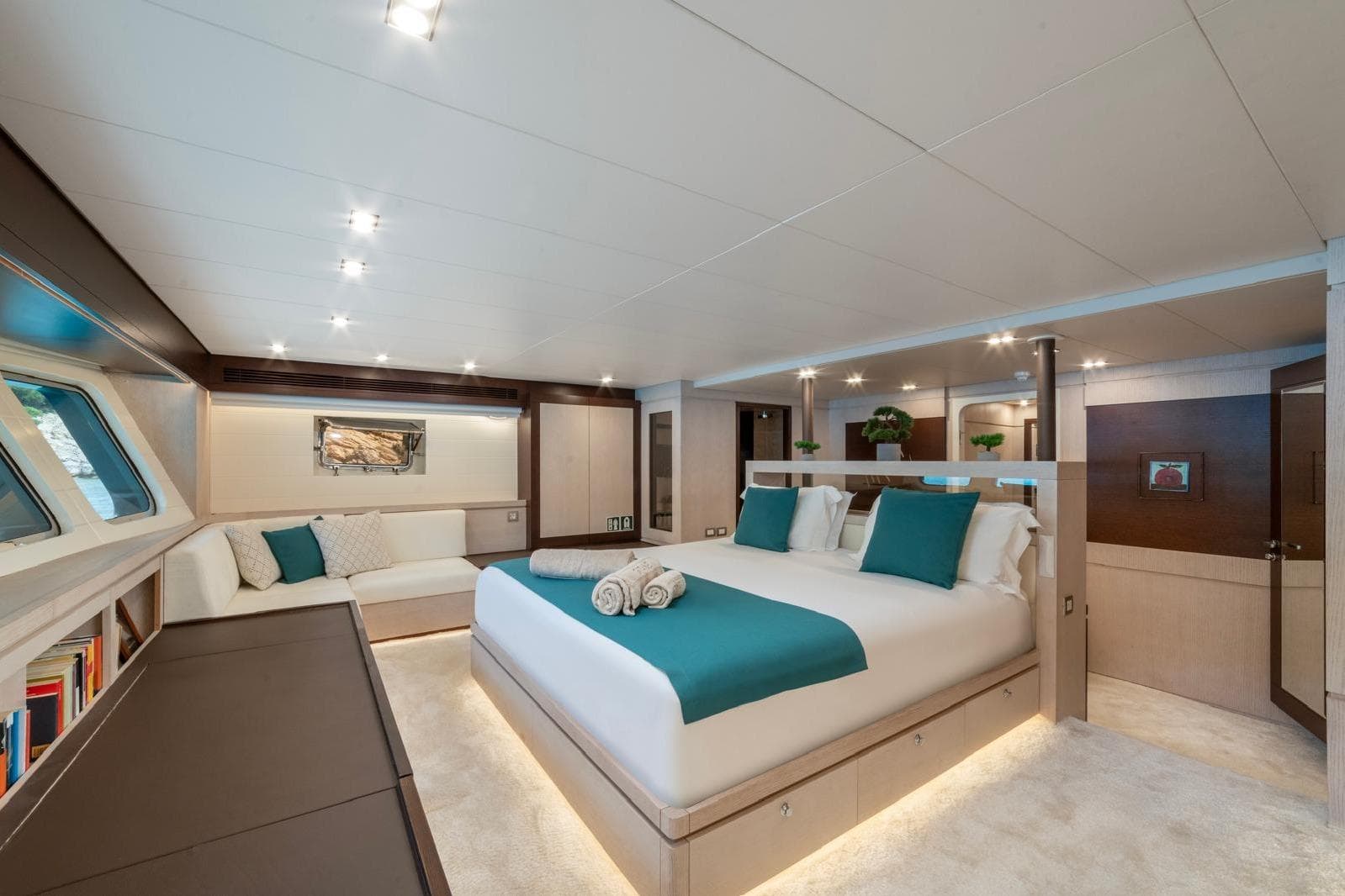 Luxurious Evadne 37mt yacht bedroom, 2008 model, with elegant decor and large windows.