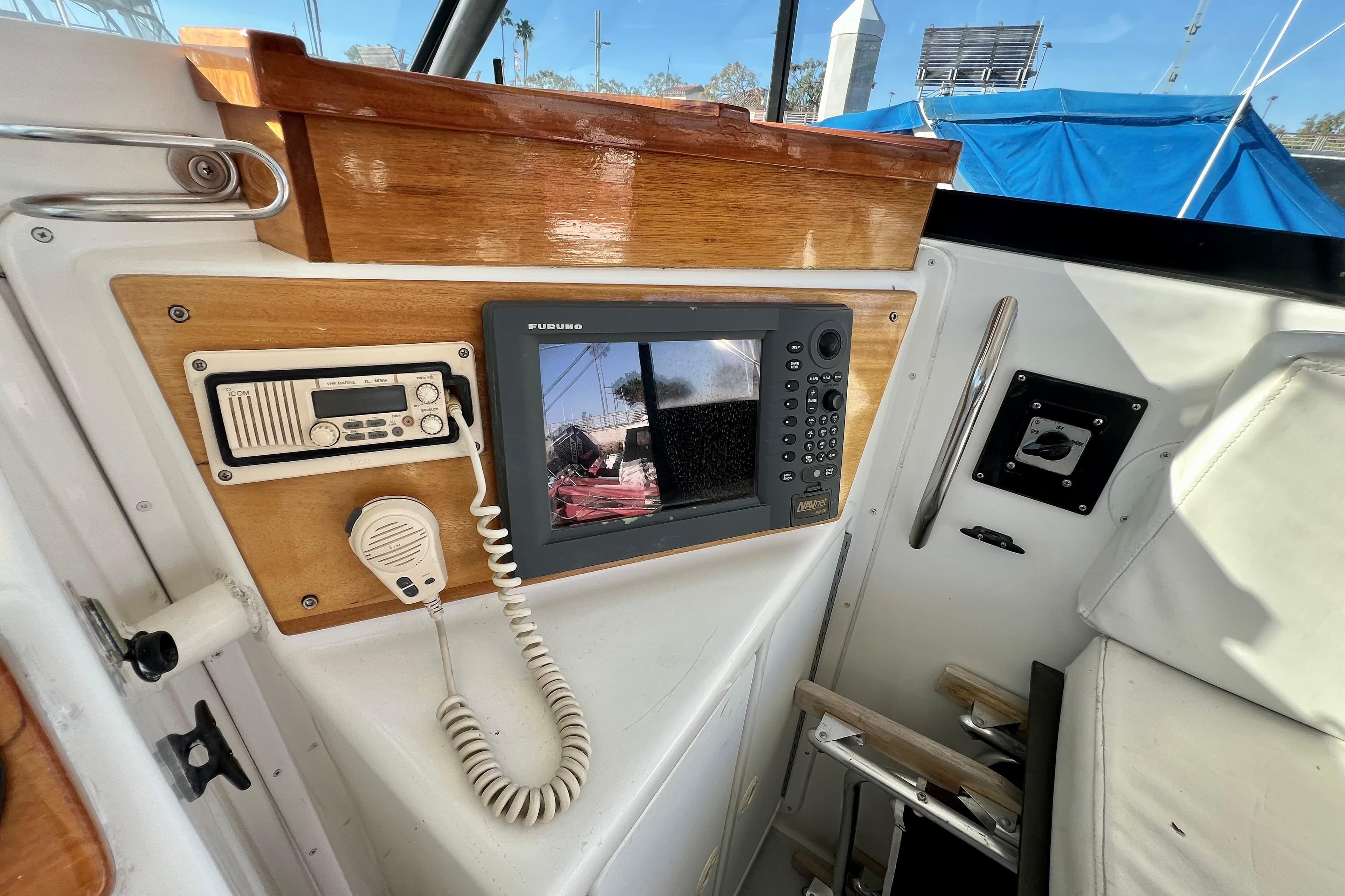 1998 Baha Cruisers 340 CAT cockpit with navigation equipment and radio system.