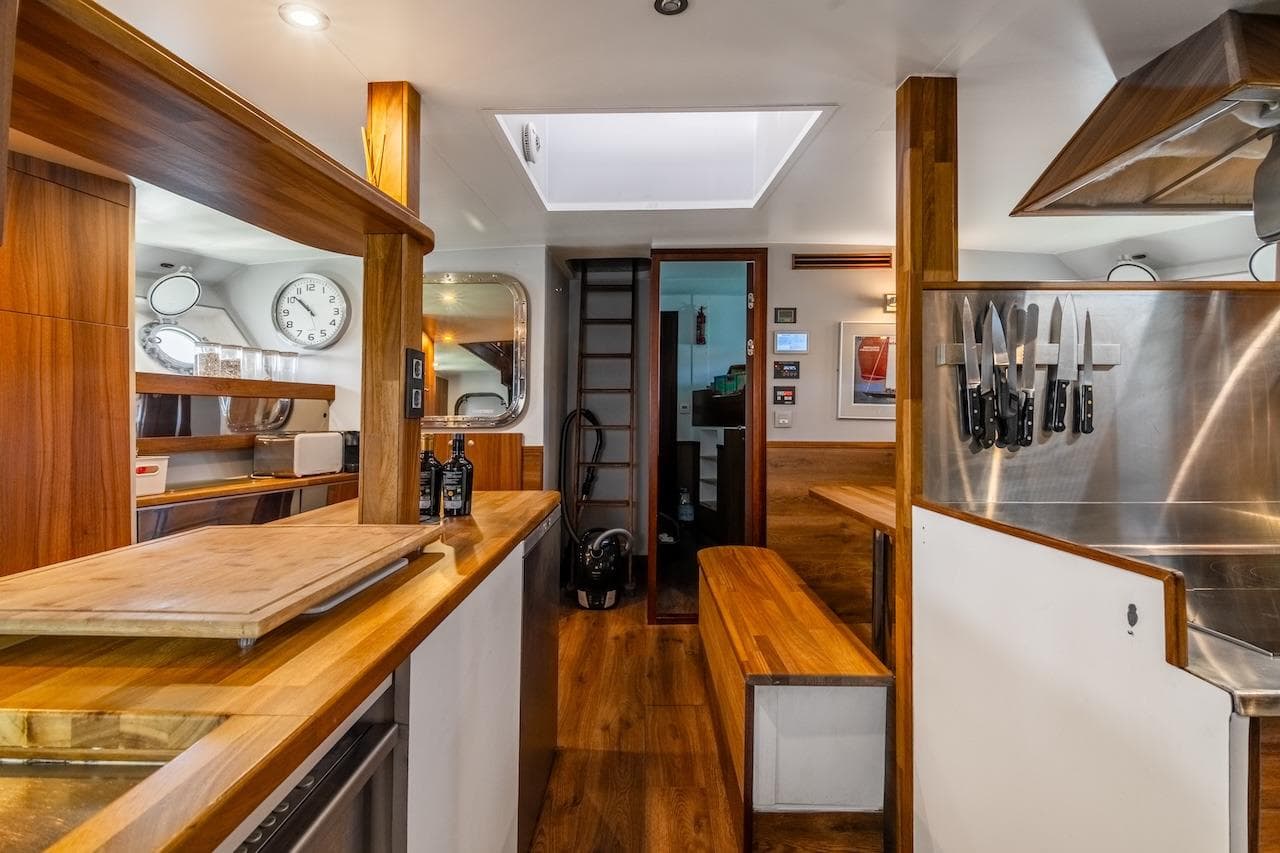 Interior of 1962 Laurent Giles TSDMY Gentleman's Motor Yacht with modern kitchen design.