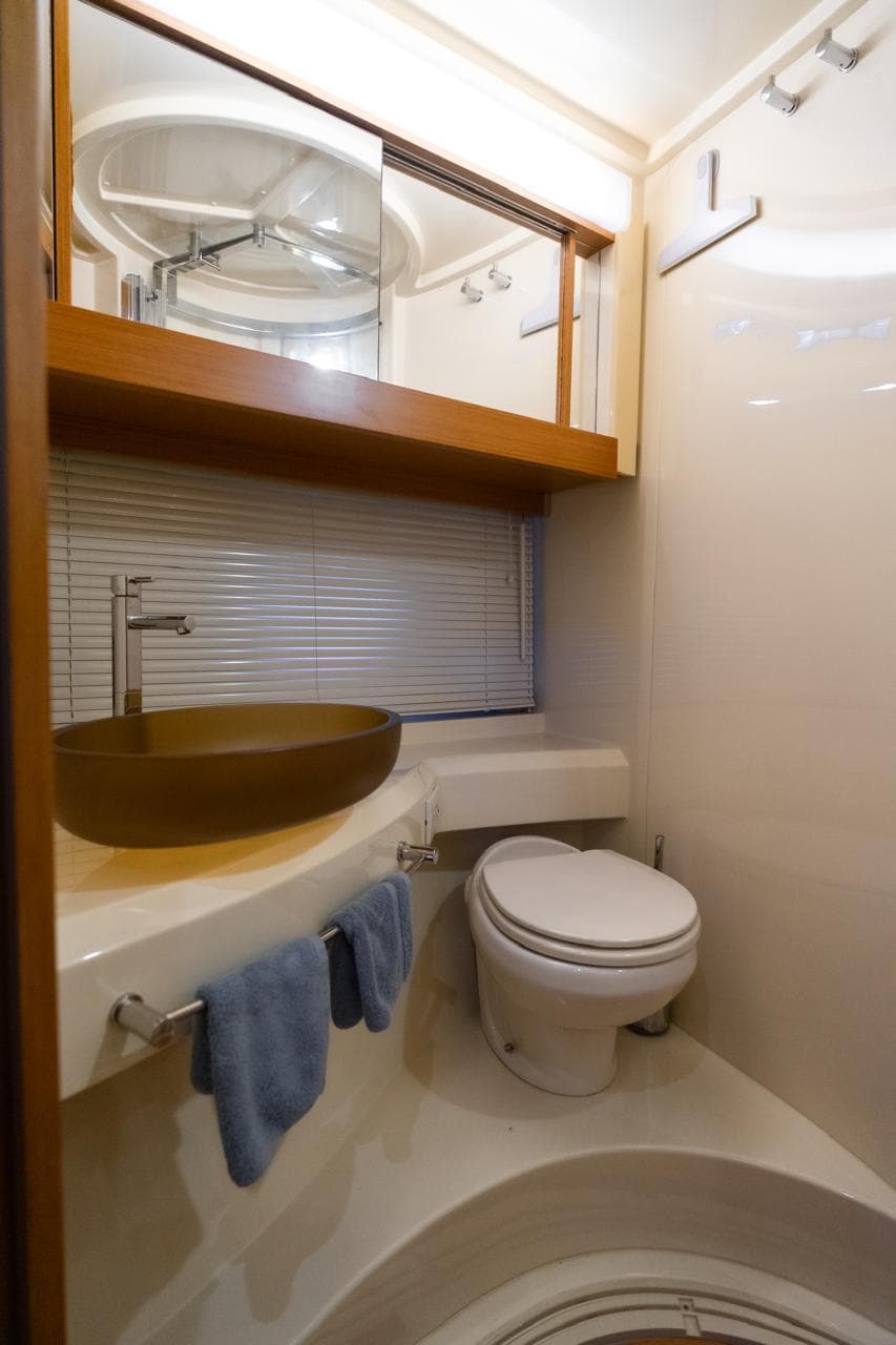 Luxurious bathroom in 2014 Azimut 45 Flybridge yacht with modern fixtures and elegant design.
