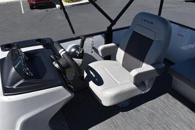 2025 Lowe LS 170 boat interior with steering console and comfortable seating.