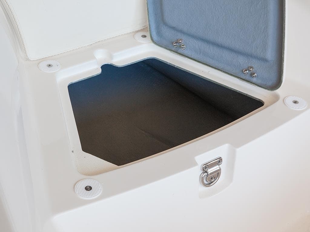 Open storage compartment on a 2014 Capelli 460 boat.