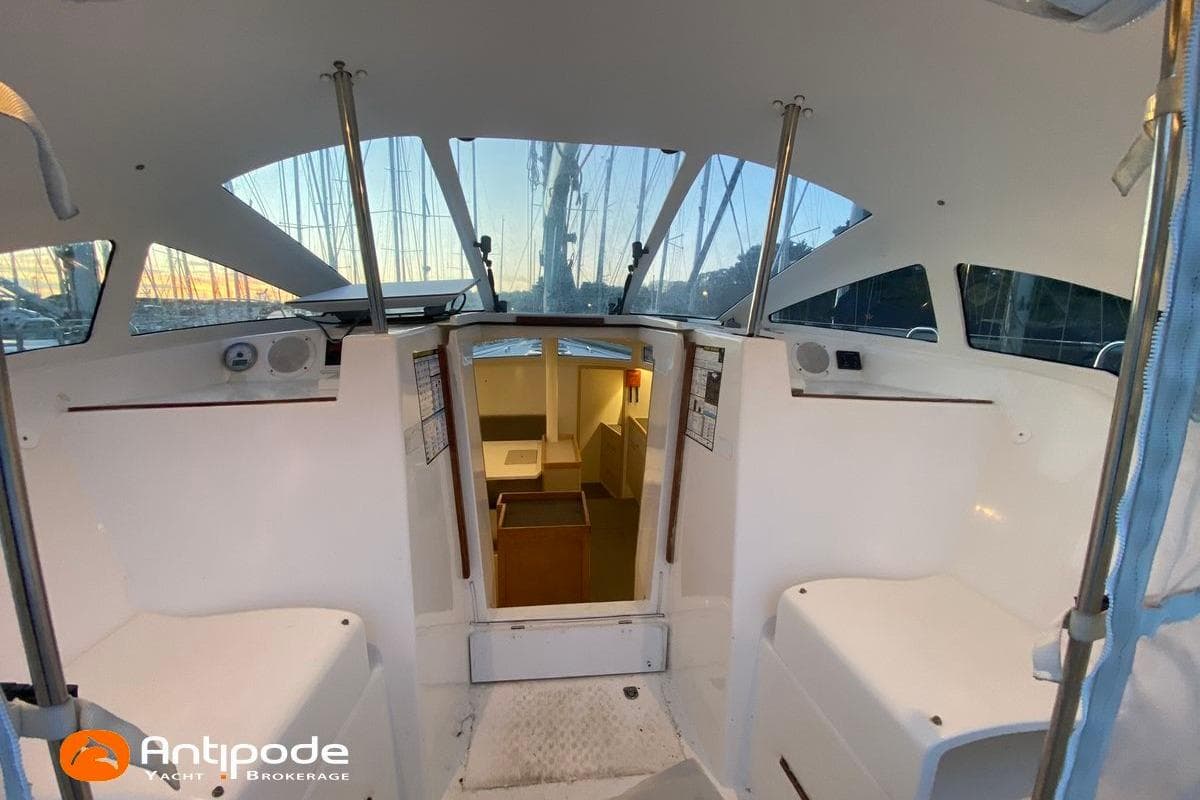 Interior view of 2018 JPK 45 FC yacht cockpit, featuring seating and cabin entrance.
