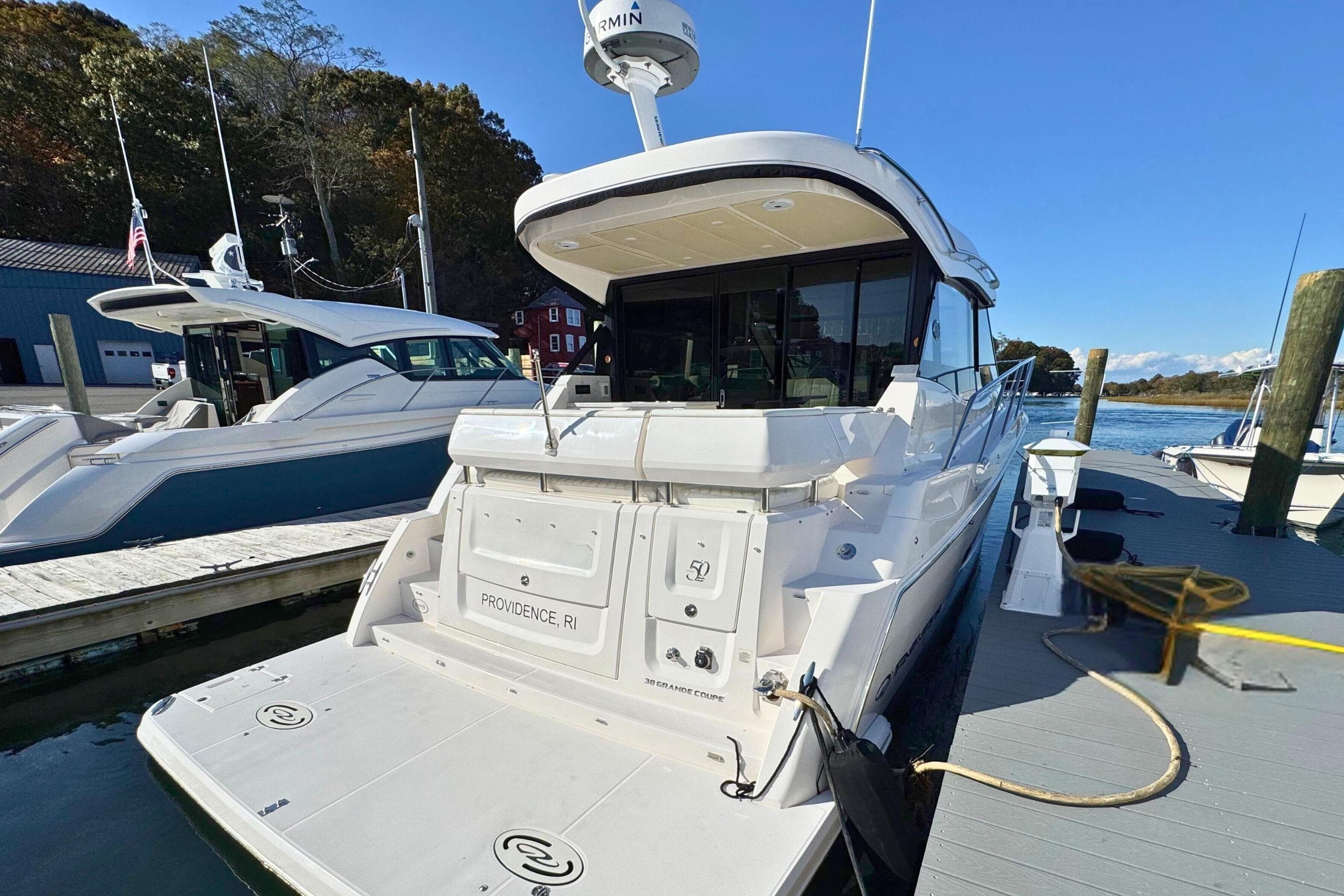2021 Regal 38 Grande Coupe yacht docked in Providence, RI marina.