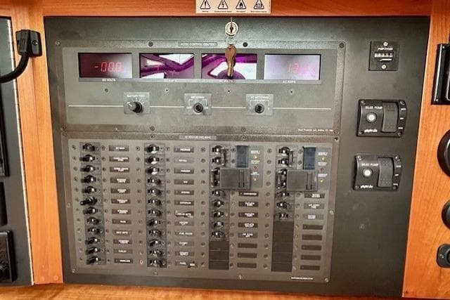 Electrical control panel of a 2016 Gozzard 41 RC yacht with switches and meters.
