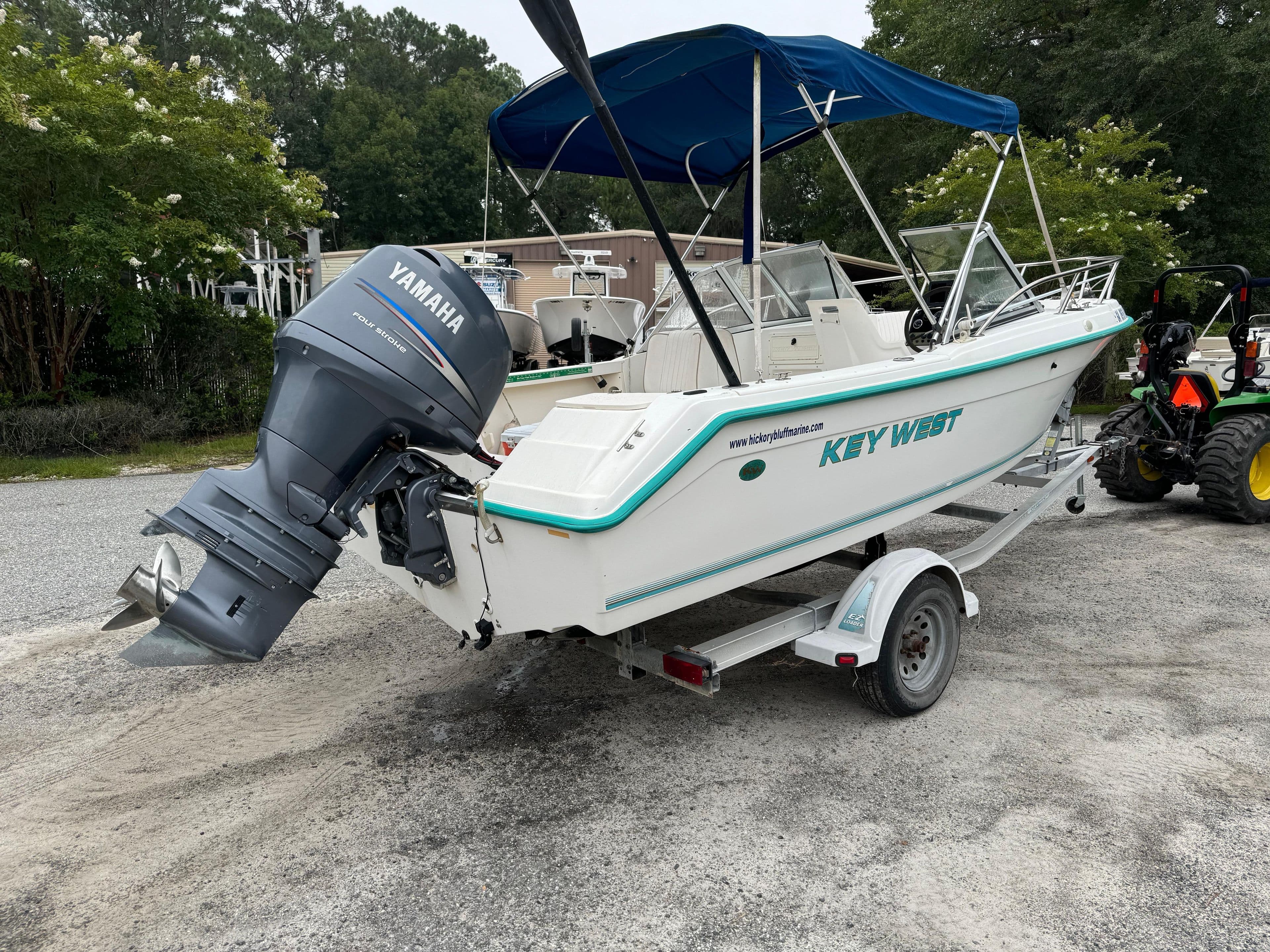 Key West 1900 Dual Console boat, 2000 model, on trailer with Yamaha outboard motor.