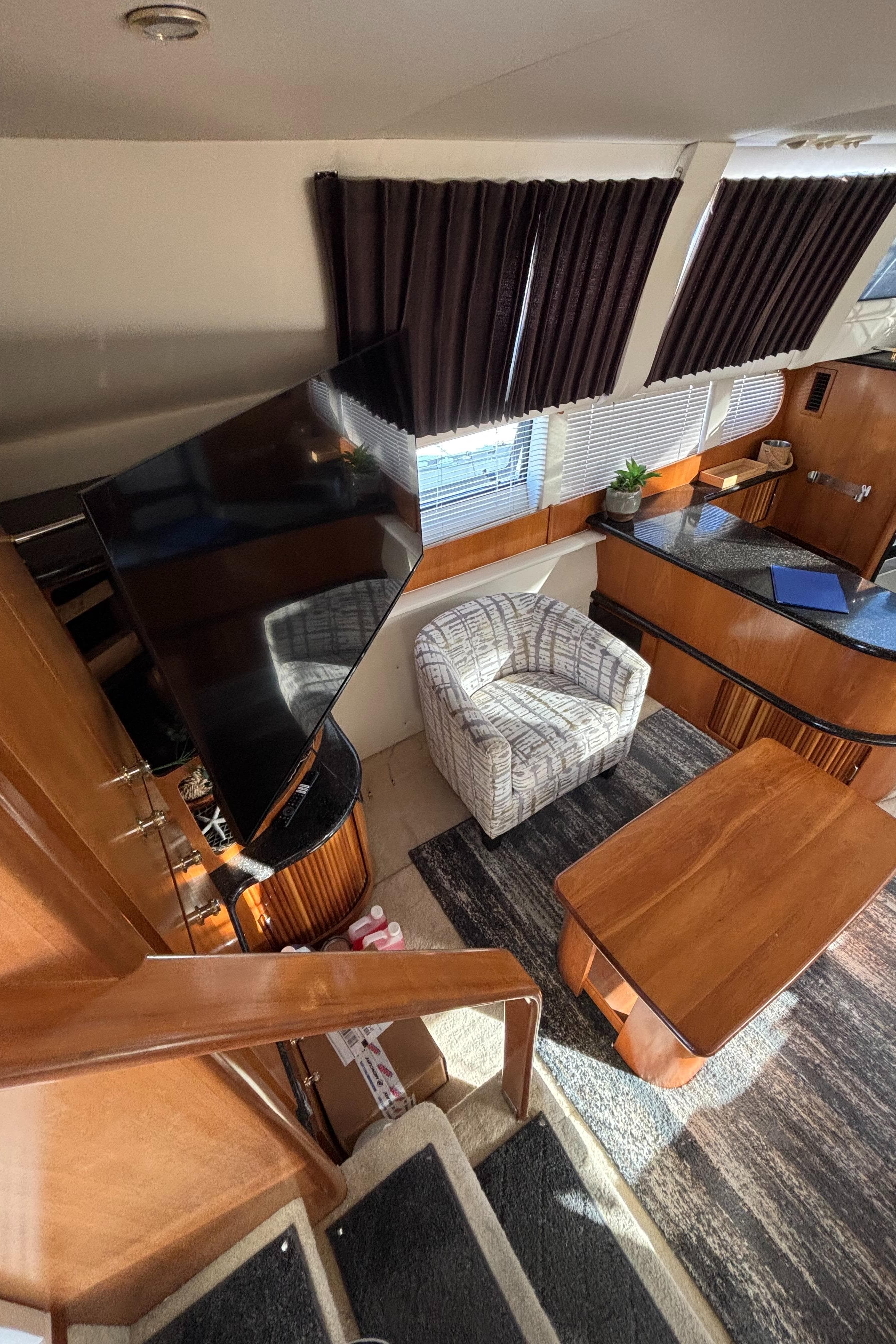 Interior of 2001 Carver 396 Aft Cabin MY with modern furnishings and natural light.