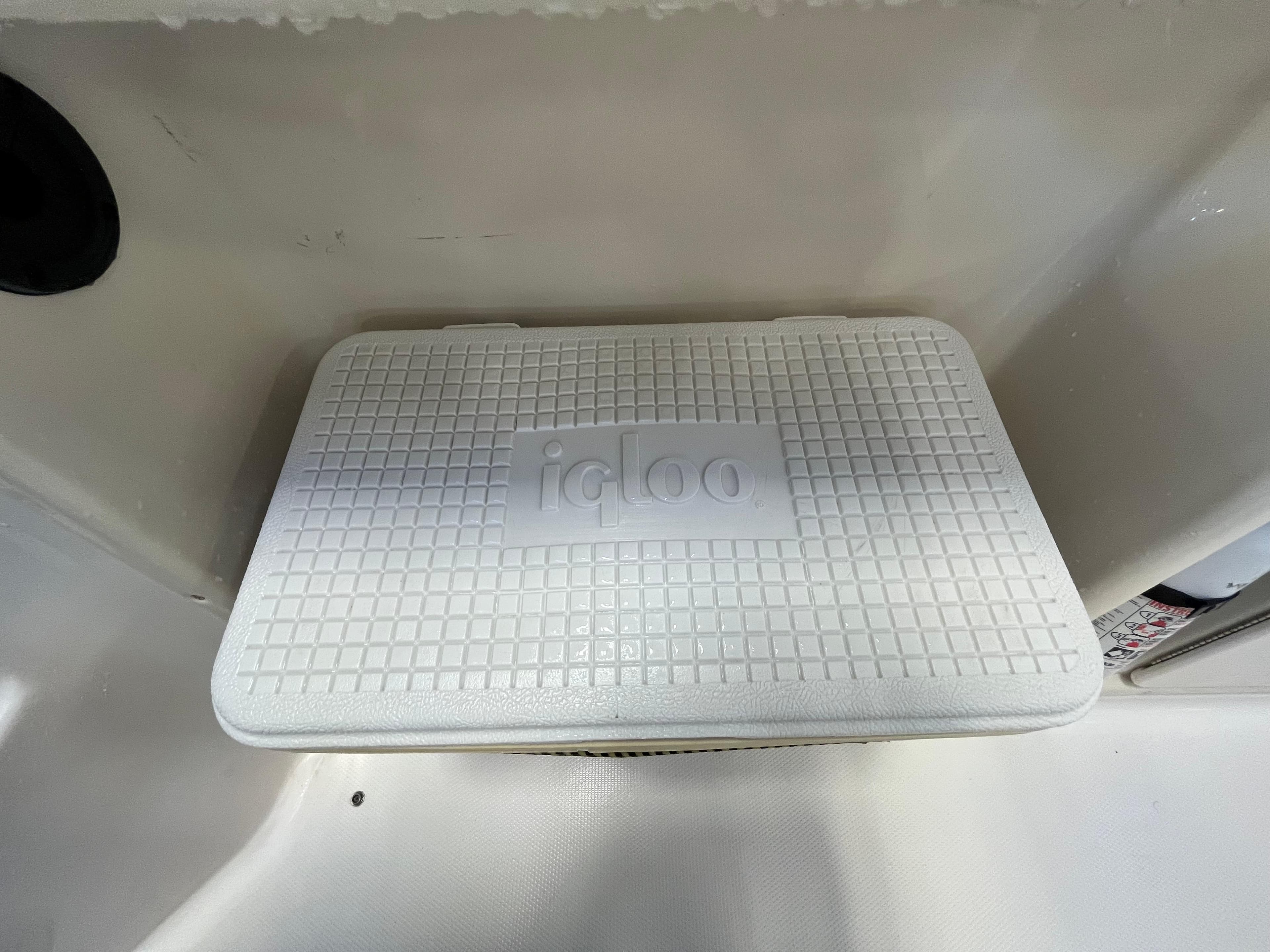 White Igloo cooler on a 2005 Godfrey FD211 boat deck.