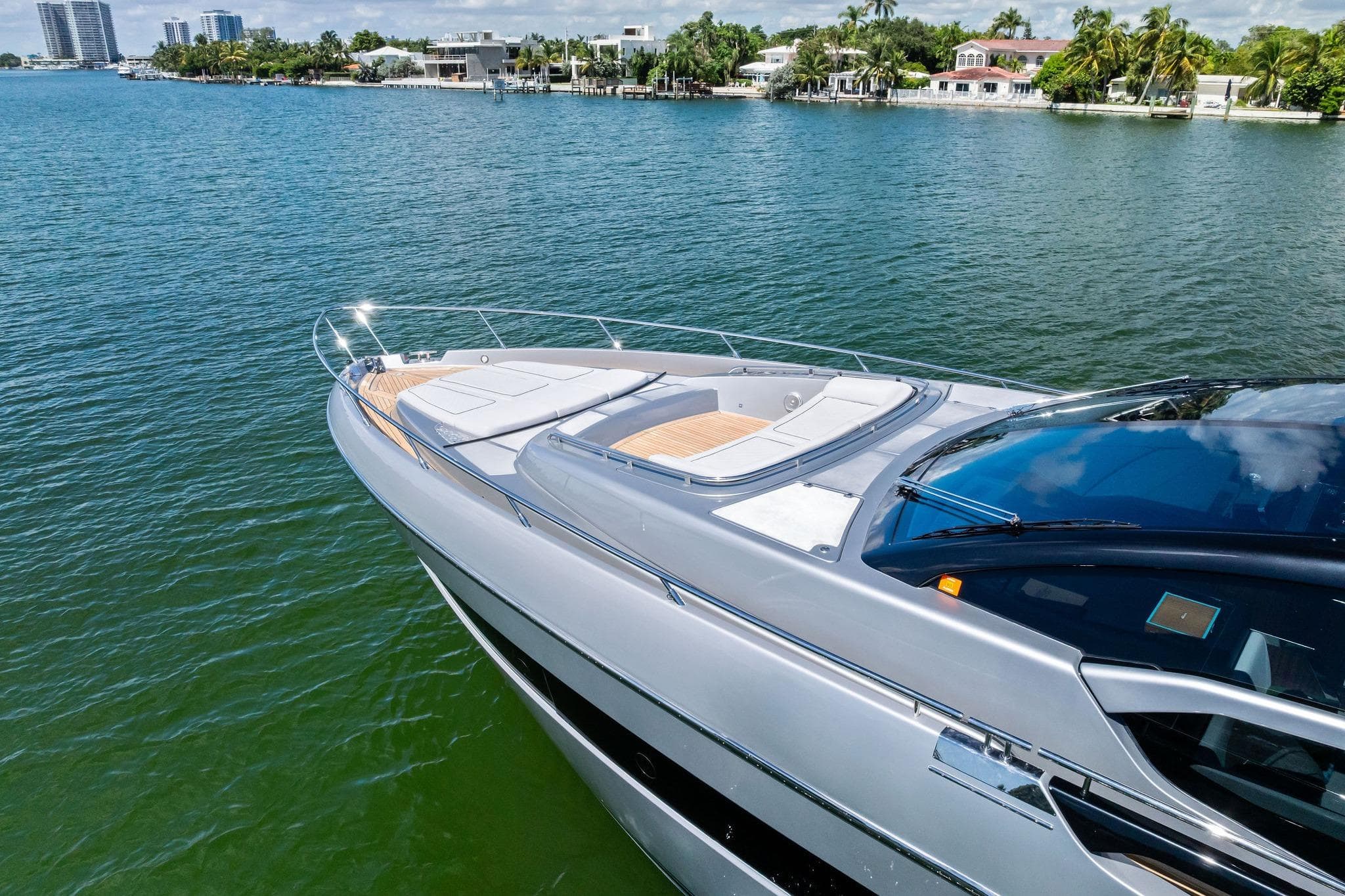 Luxury 2023 Riva 76 PERSEO Super yacht on serene water, showcasing sleek design.