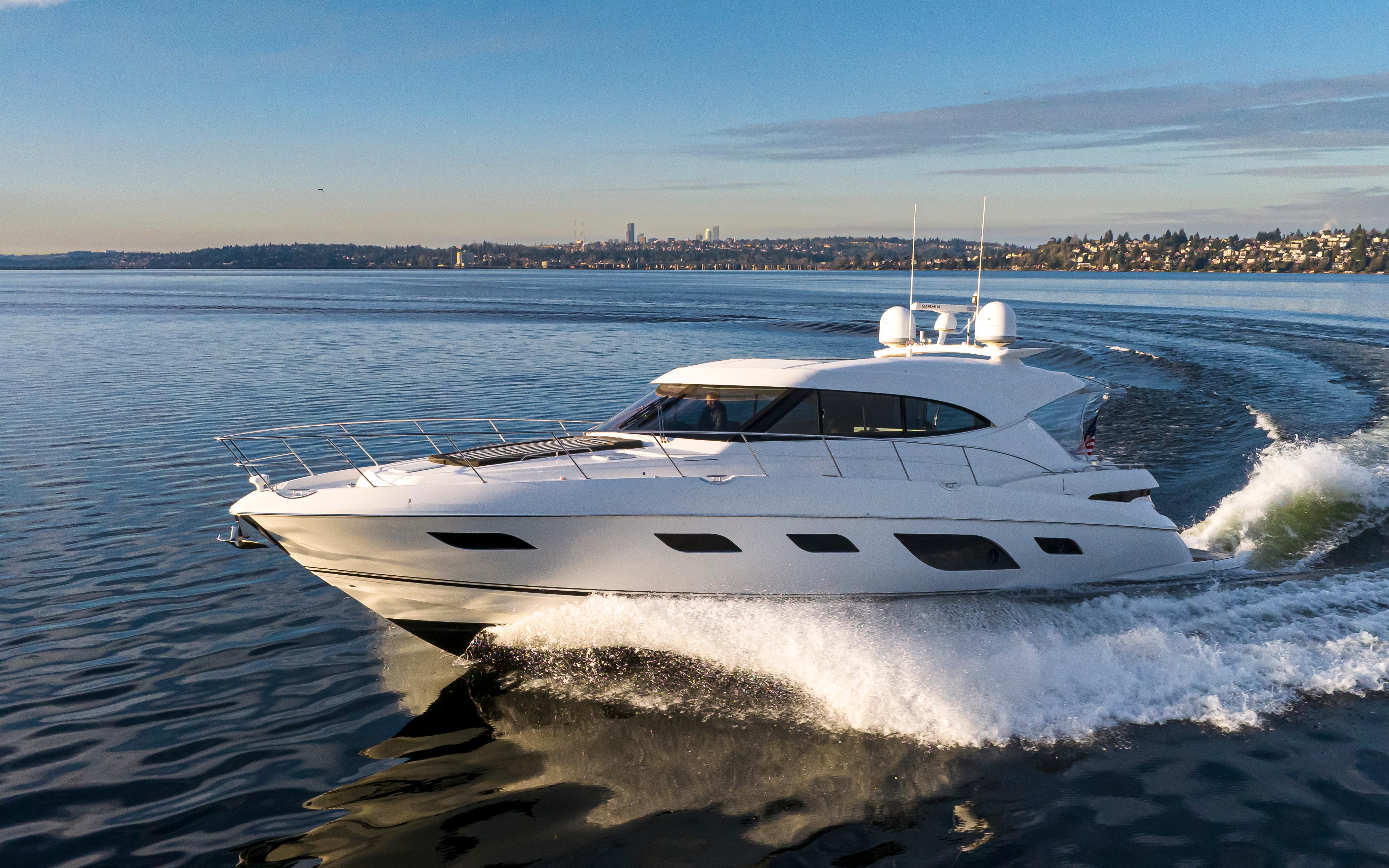2017 Riviera Sport Cruiser yacht gliding on calm waters under a clear sky.