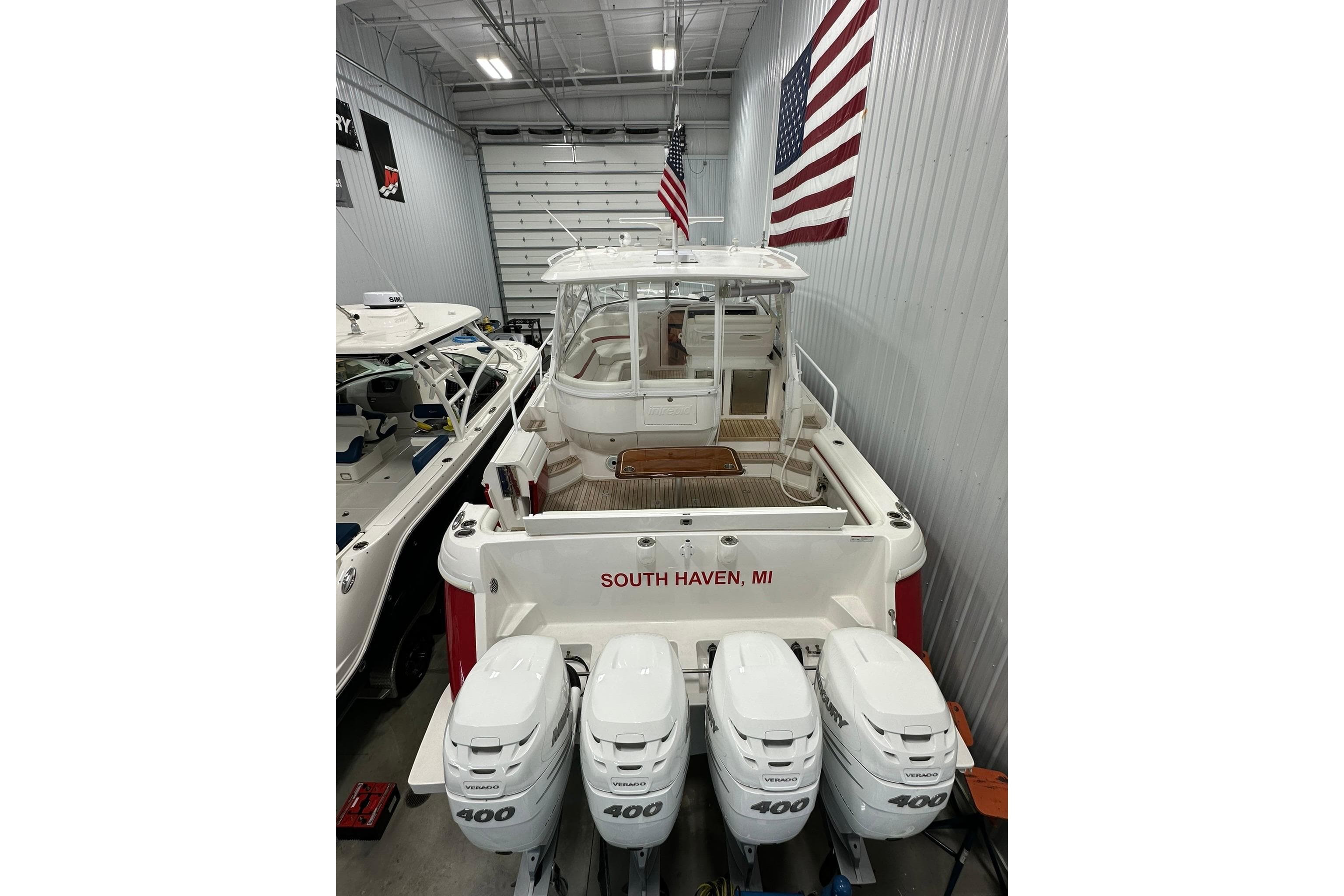 2020 Intrepid 475 Sport Yacht in a garage, featuring quad 400 engines, South Haven, MI.