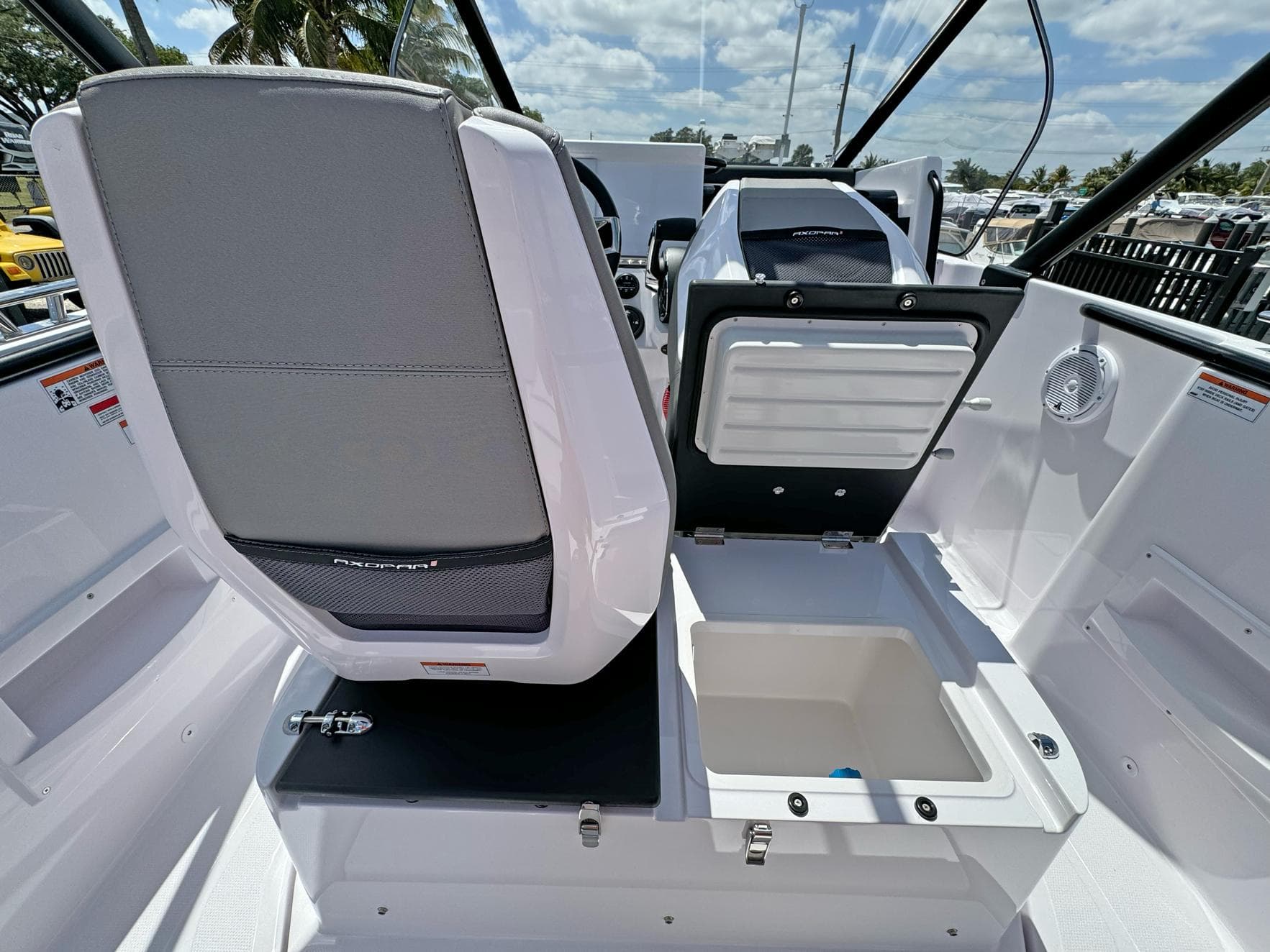 2024 Axopar 25 Cross Top boat interior with seating and storage compartments.