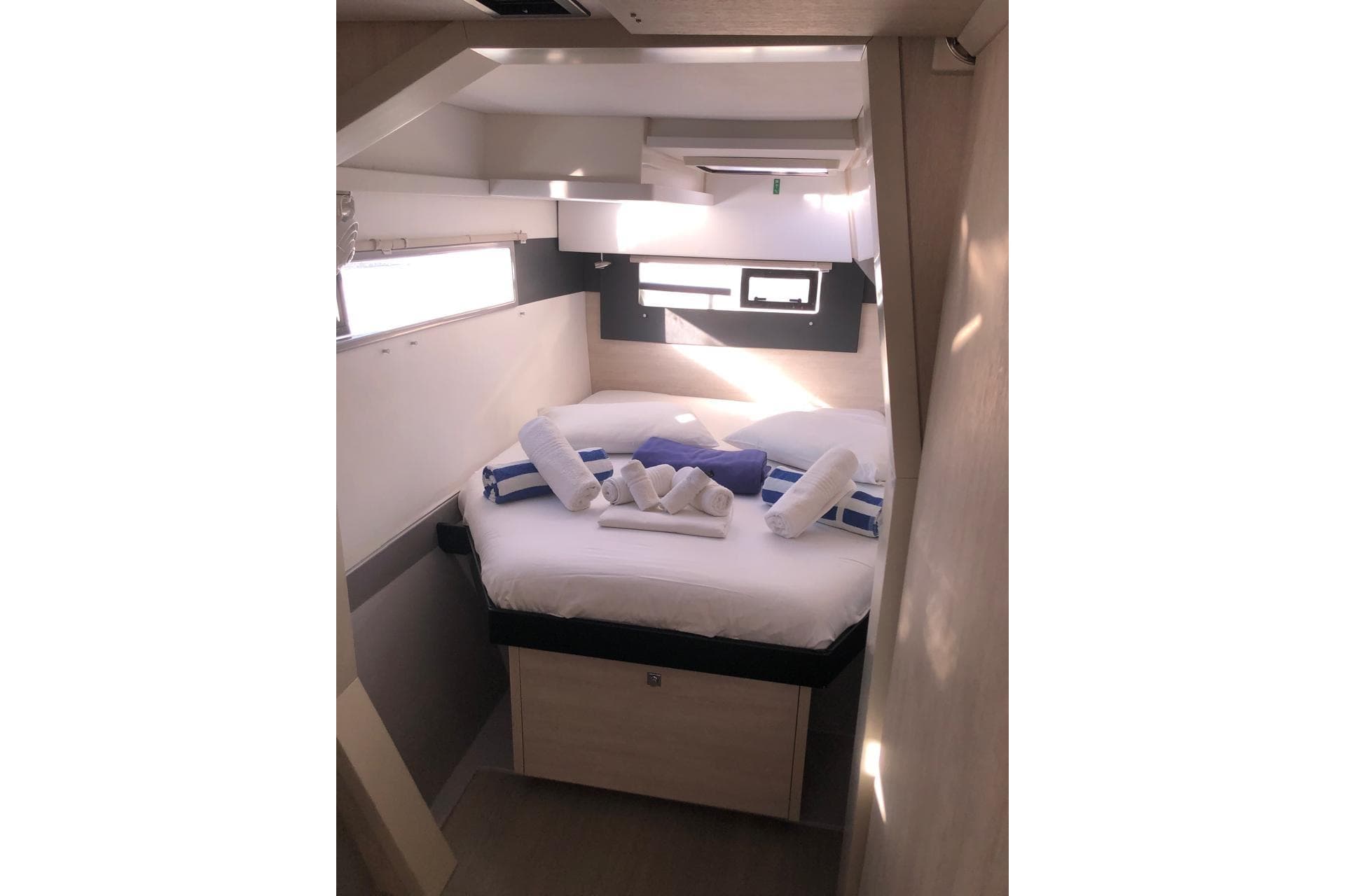 Cozy cabin interior of 2020 Leopard 40 yacht with neatly arranged towels.