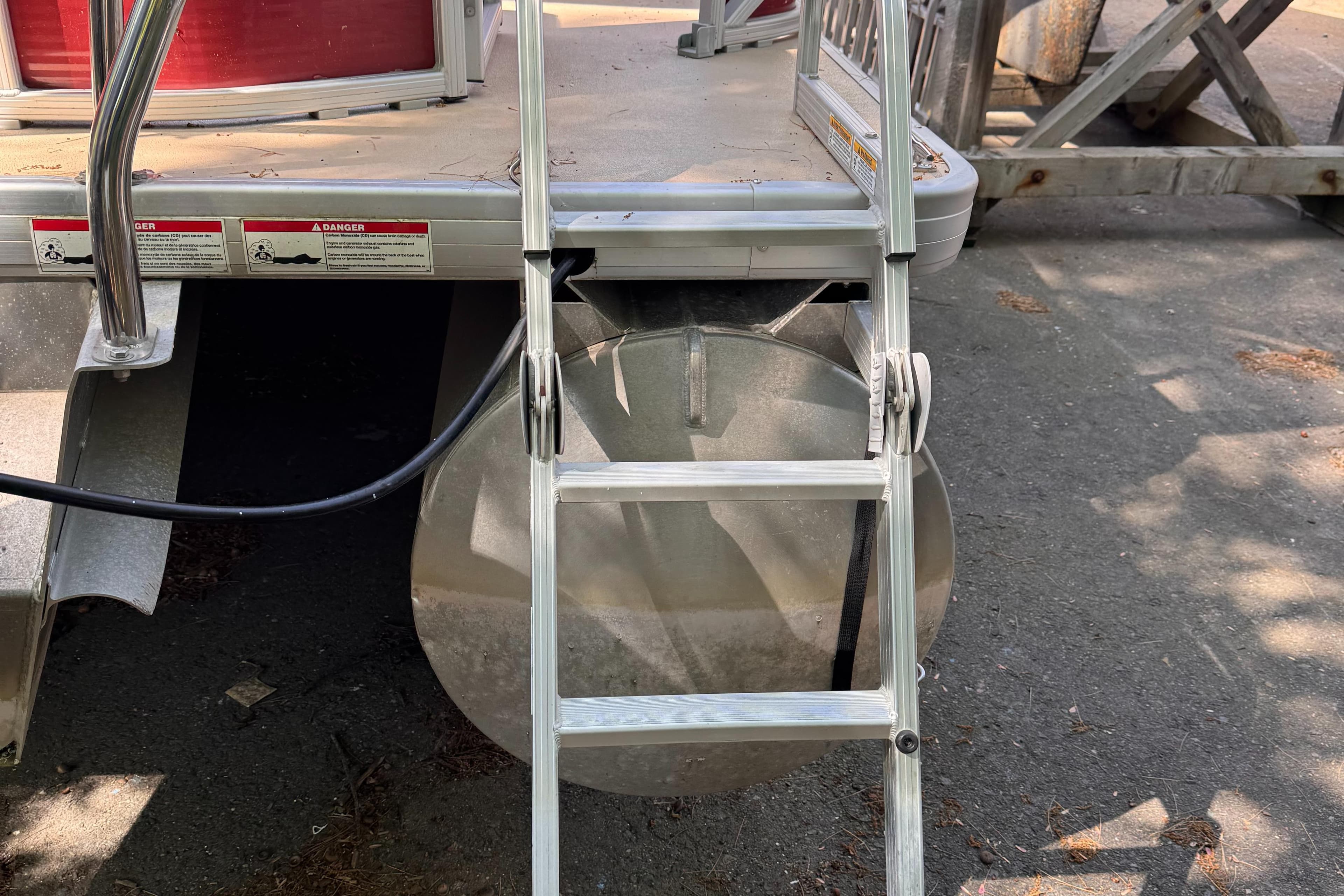 Aluminum ladder attached to Sweetwater Premium Edition 200 boat, 2015 model.