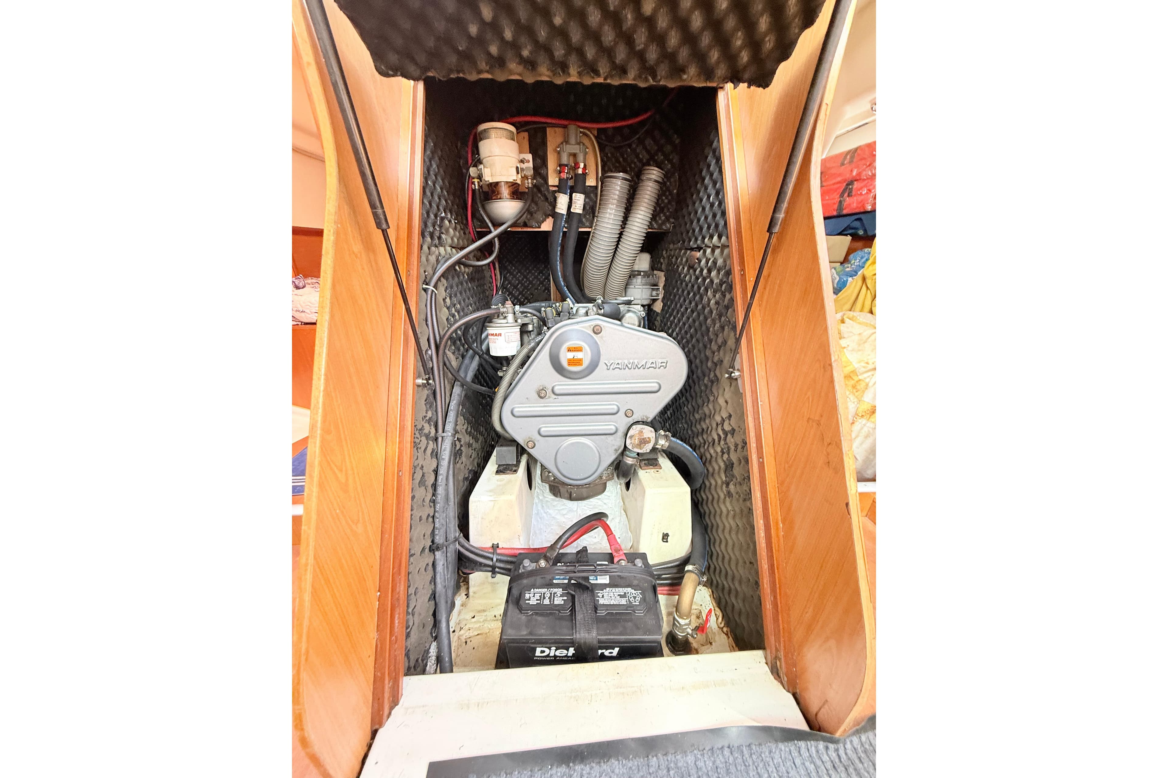 Engine compartment of a 2009 Beneteau Oceanis 40 sailboat, featuring a Yanmar engine.