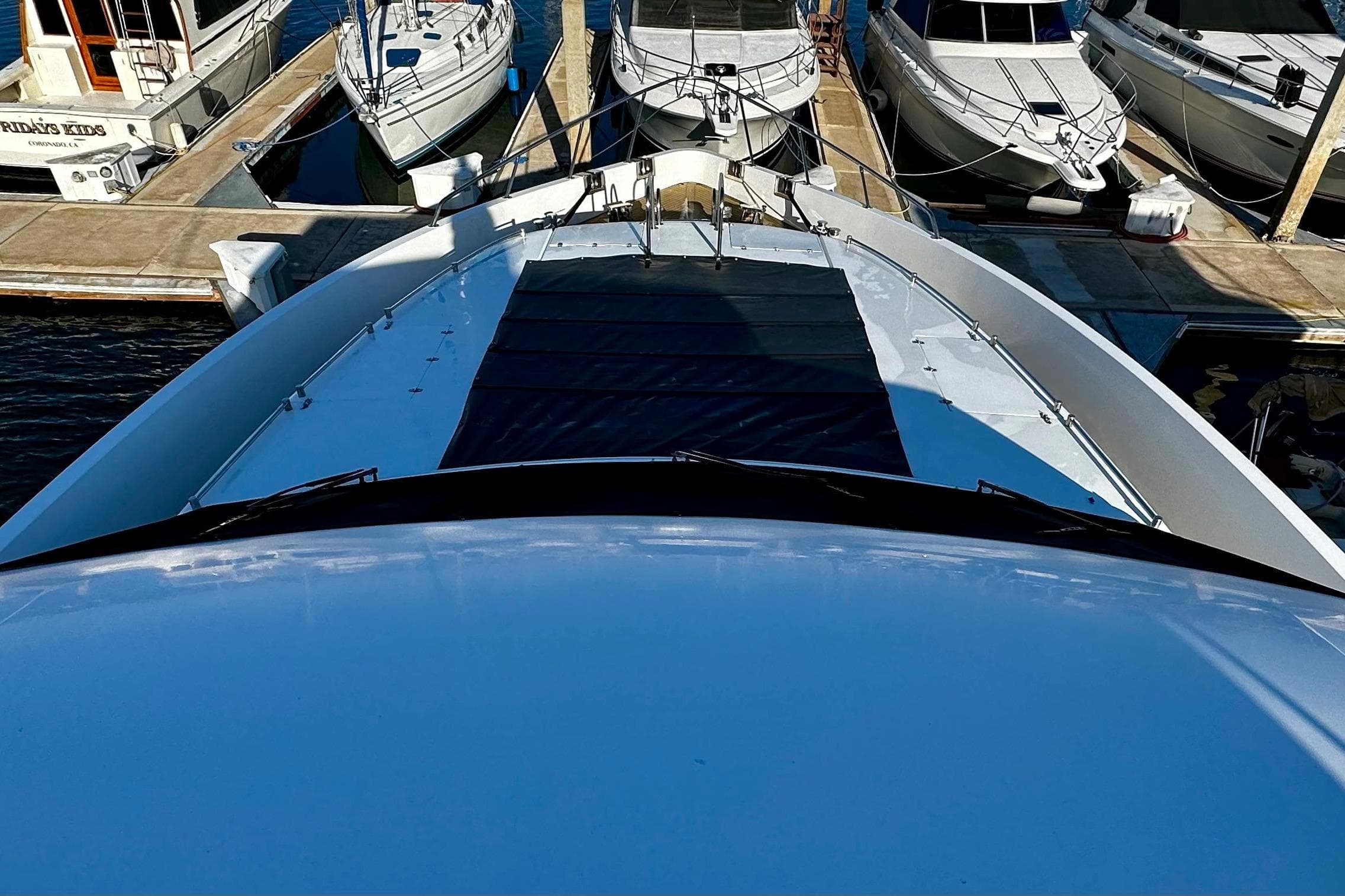 Bow view of 1996 Monte Fino 92 yacht docked at marina.