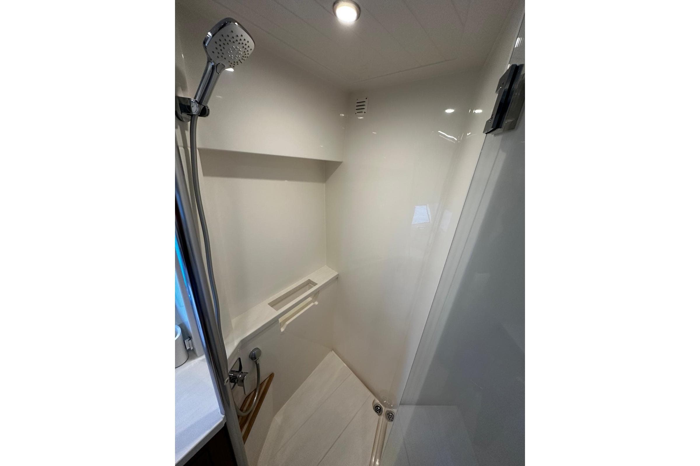 Shower area in 2023 Riviera 465 SUV, featuring modern fixtures and sleek design.